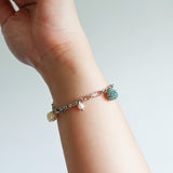 Ada Bracelet in Ocean Green Hand 1