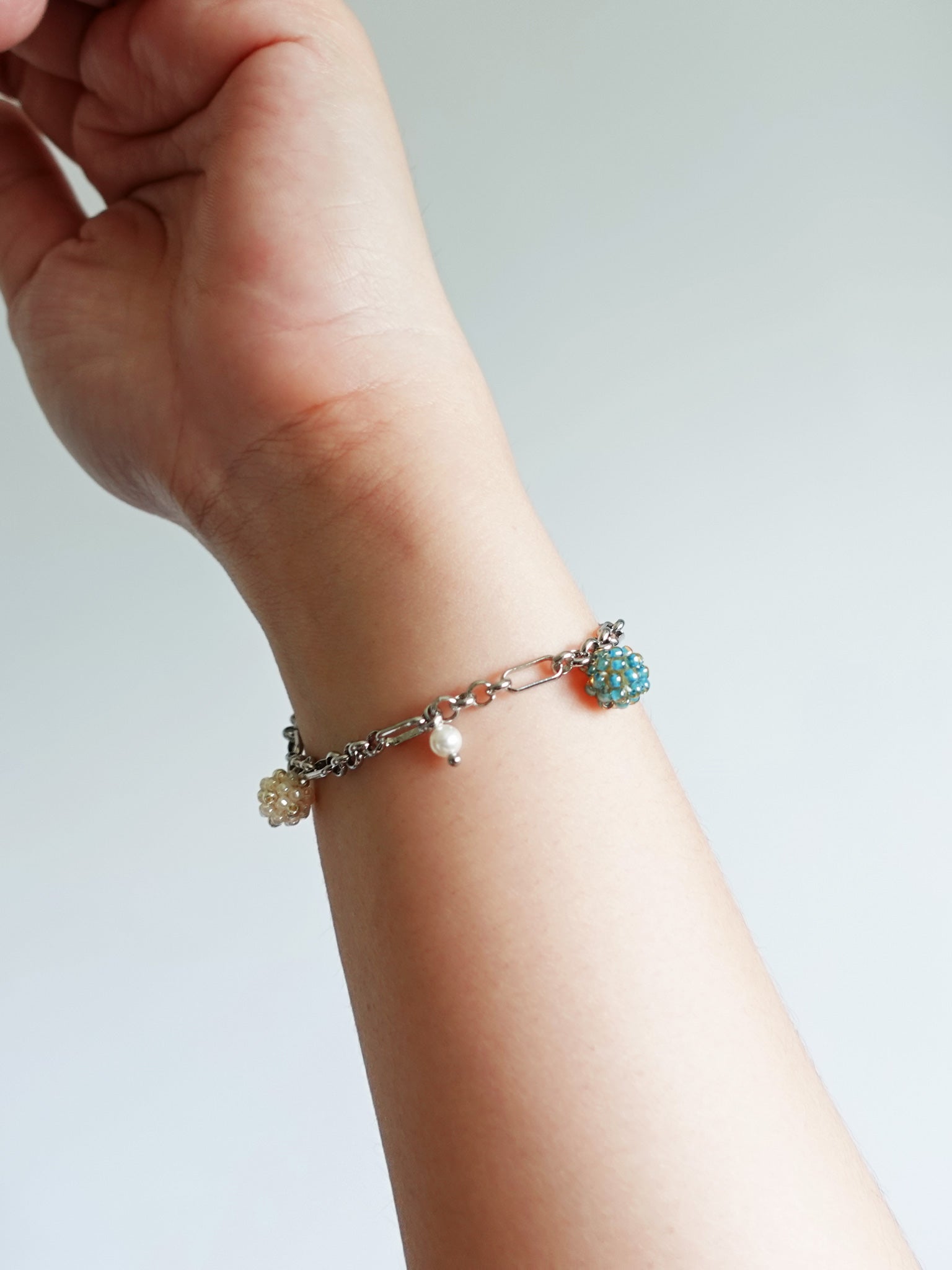 Ada Bracelet in Ocean Green Hand 1