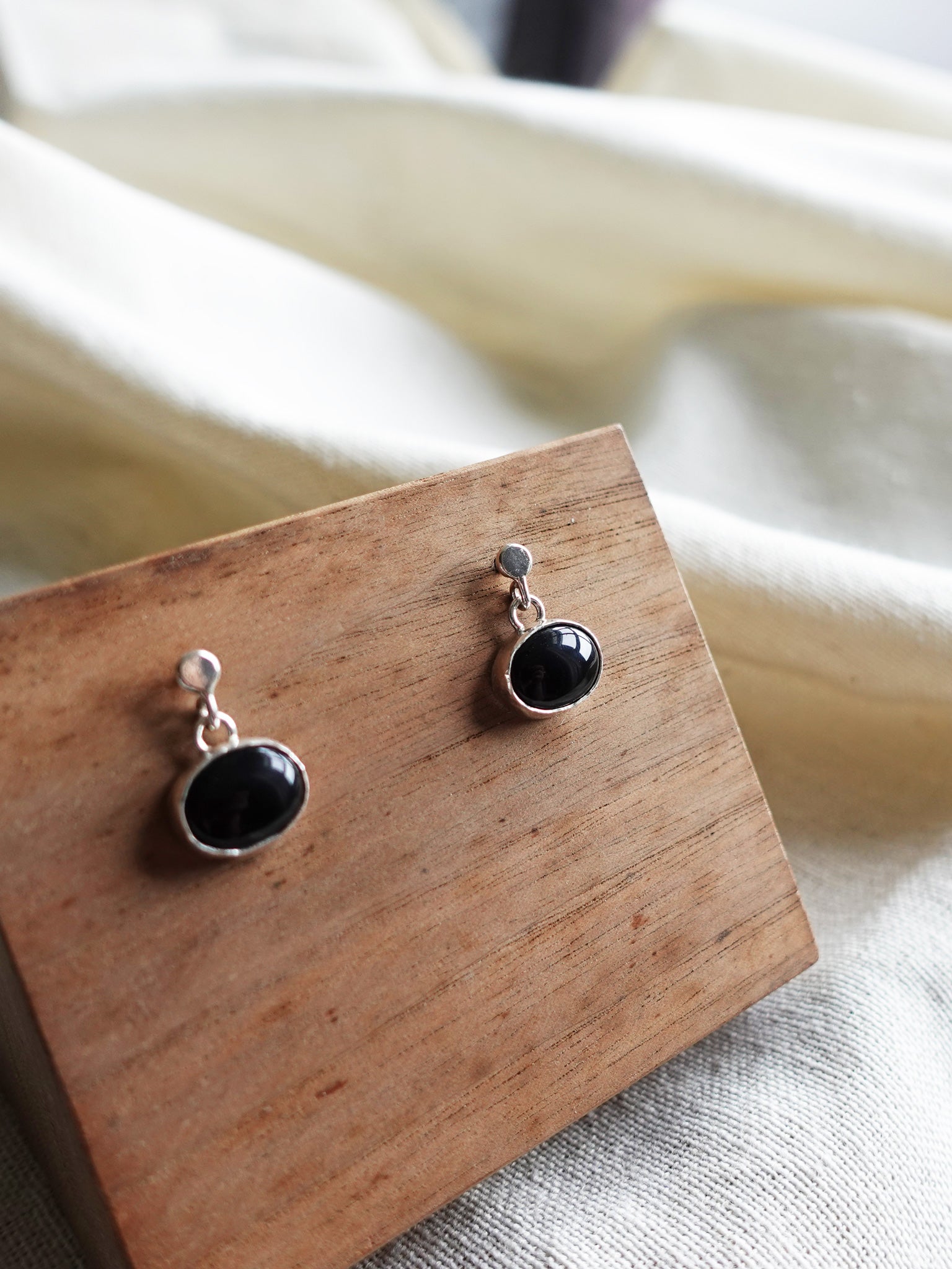 Black Oval Onyx Drop Earrings Left