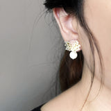 Camellia Cream Drop Earrings in Pale Pink Model