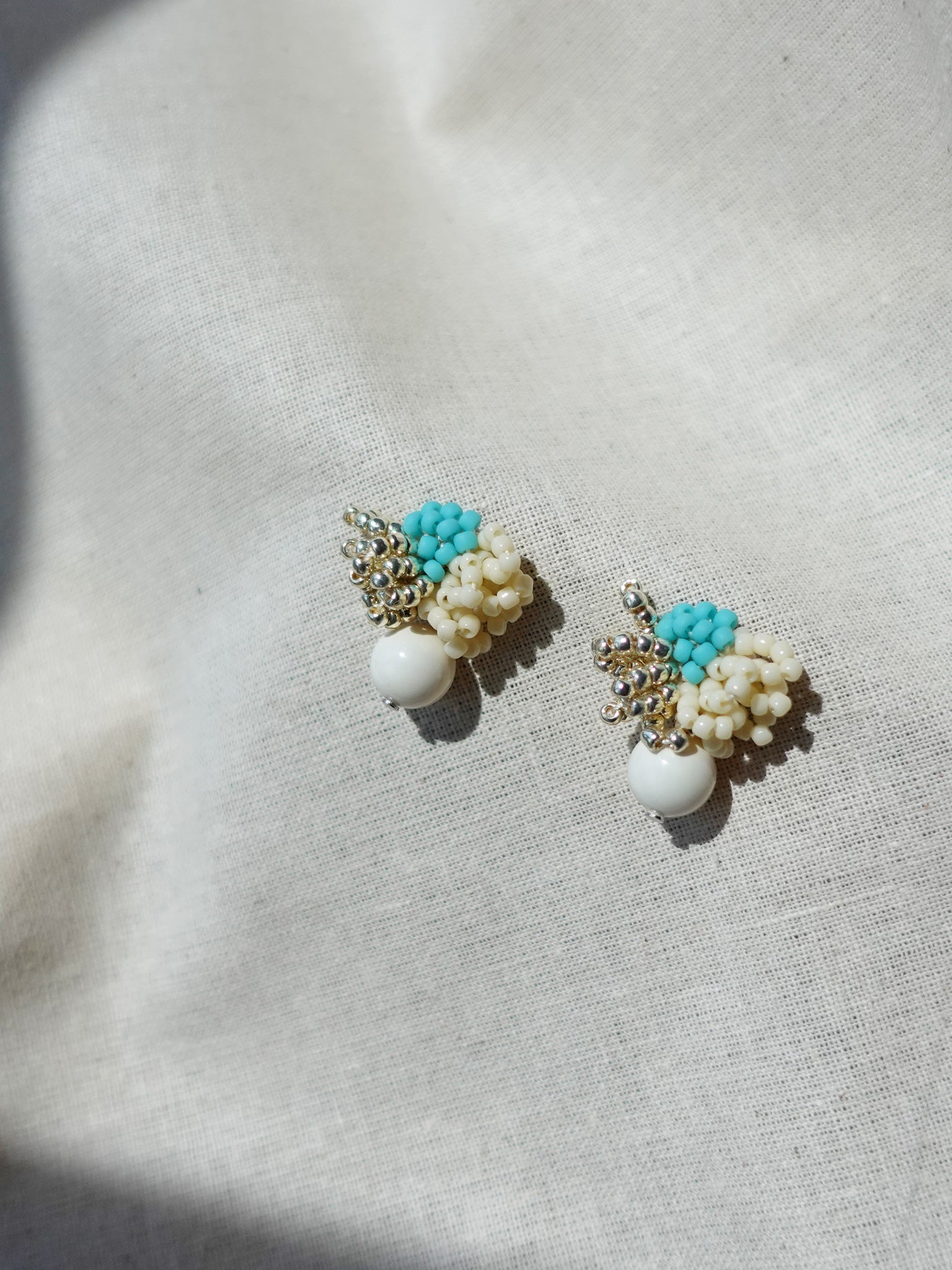 Camellia Cream Drop Earrings in Turquoise Left