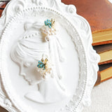 Fantasia Snowball Earrings in Ocean Green Girl