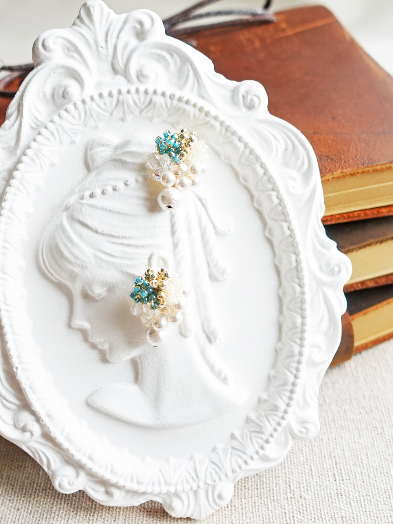 Fantasia Snowball Earrings in Ocean Green Girl
