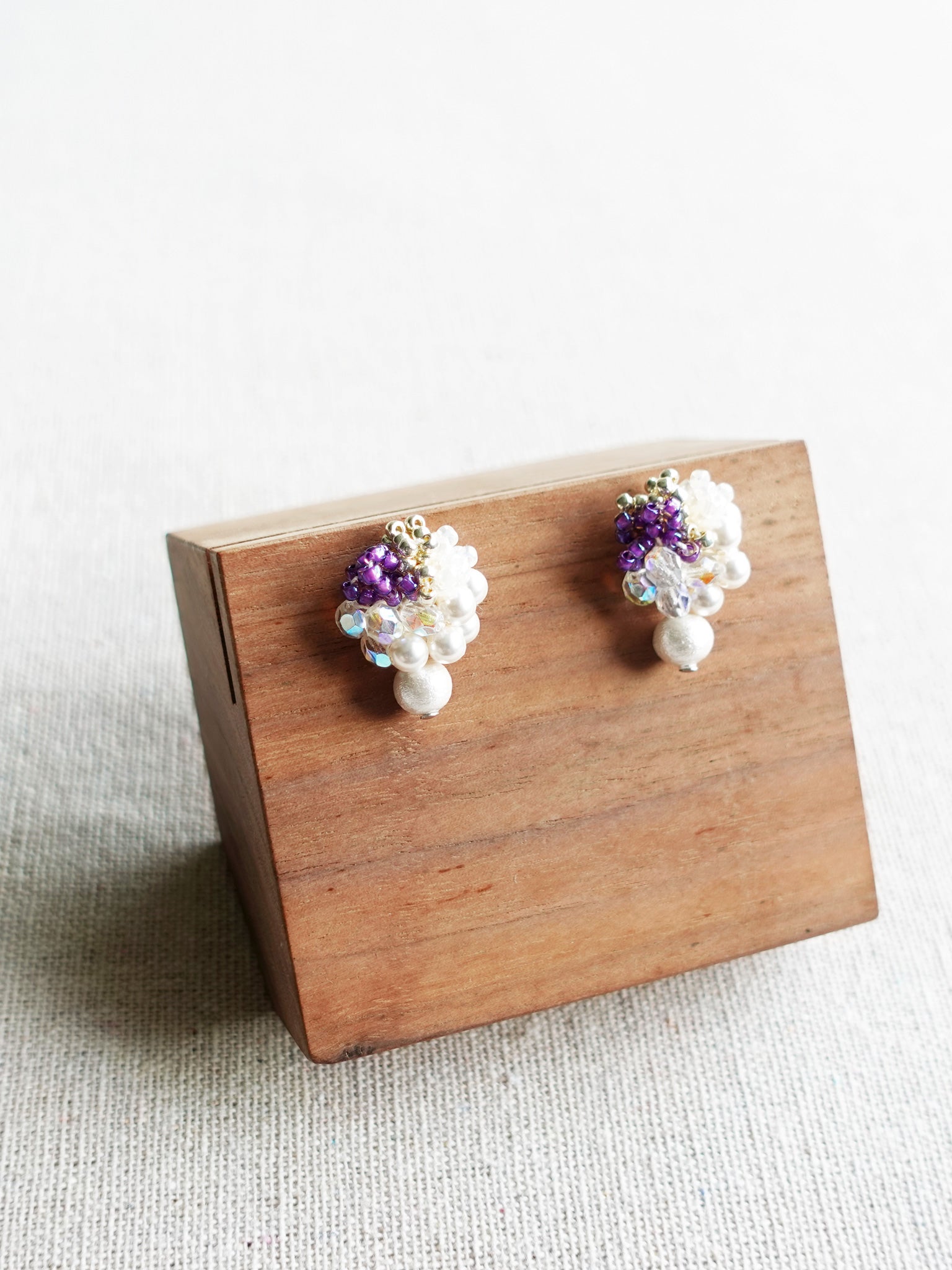 Fantasia Snowball Earrings in Royal Purple Display Left