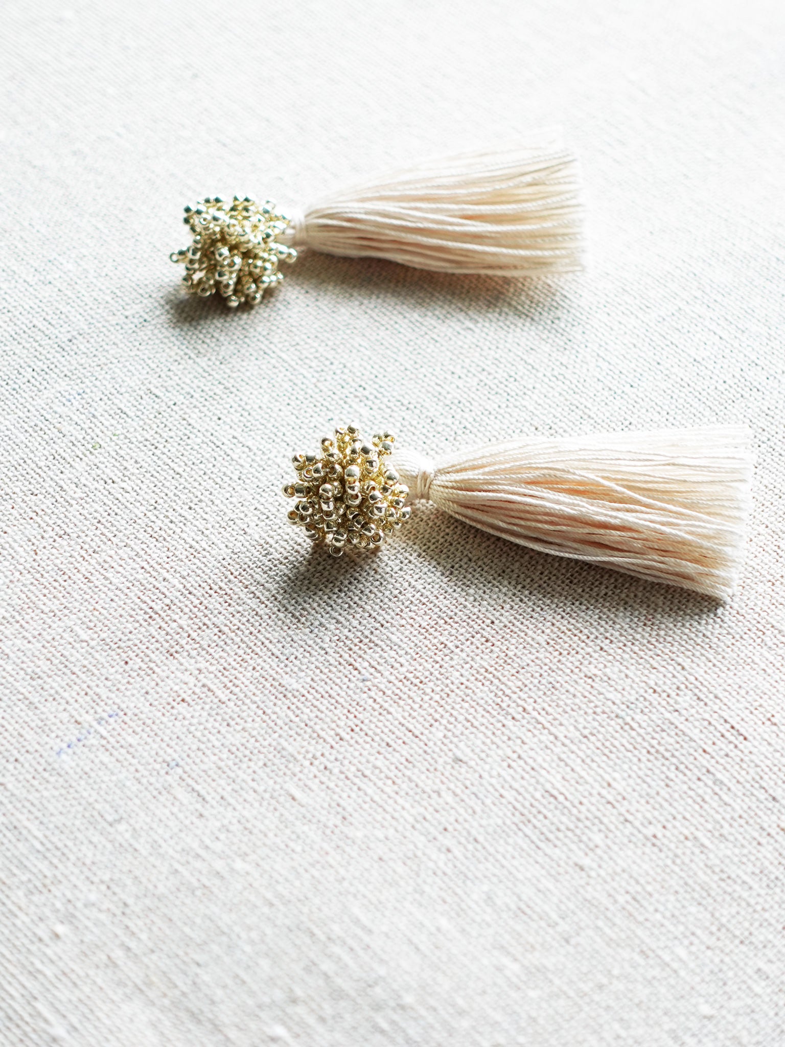Fluffy Dos Tassel Earrings in Gold Side