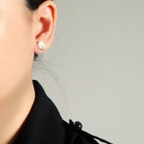 Last Quarter Petite Stud Earrings in White Model