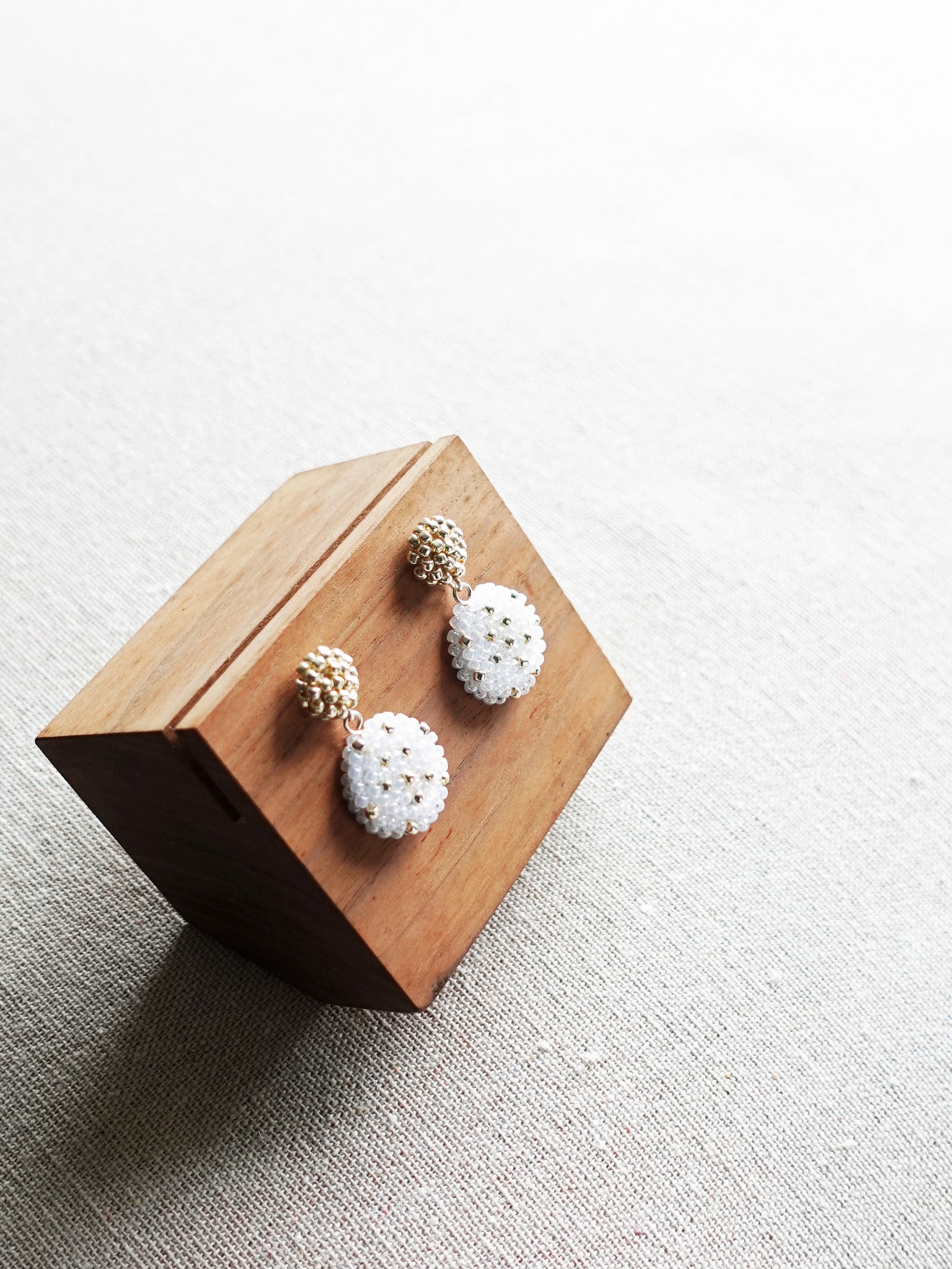 Maevan Earrings in Gold Display Top