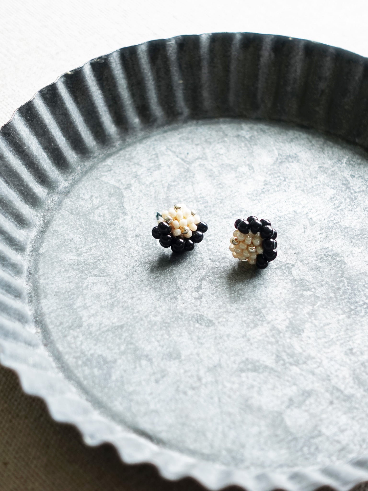 Ophira Star Dust Stud Earrings in Beige Tray Left