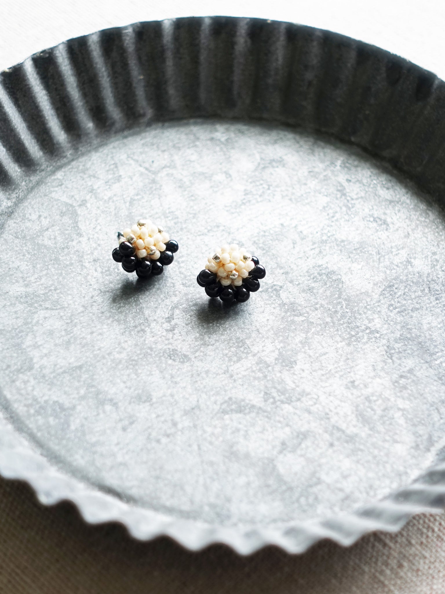 Ophira Star Dust Stud Earrings in Beige Tray Right