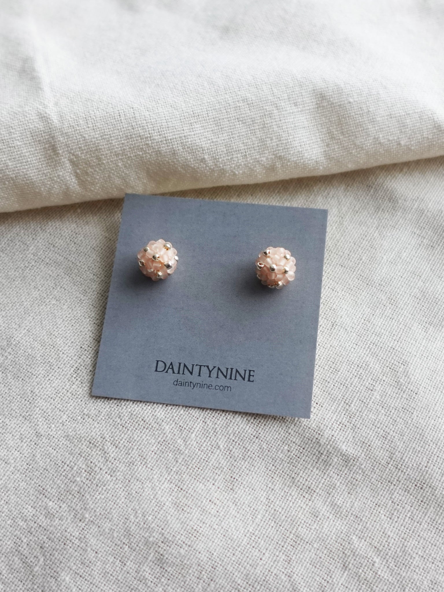 Orb Star Dust Stud Earrings in Blush Pink Card