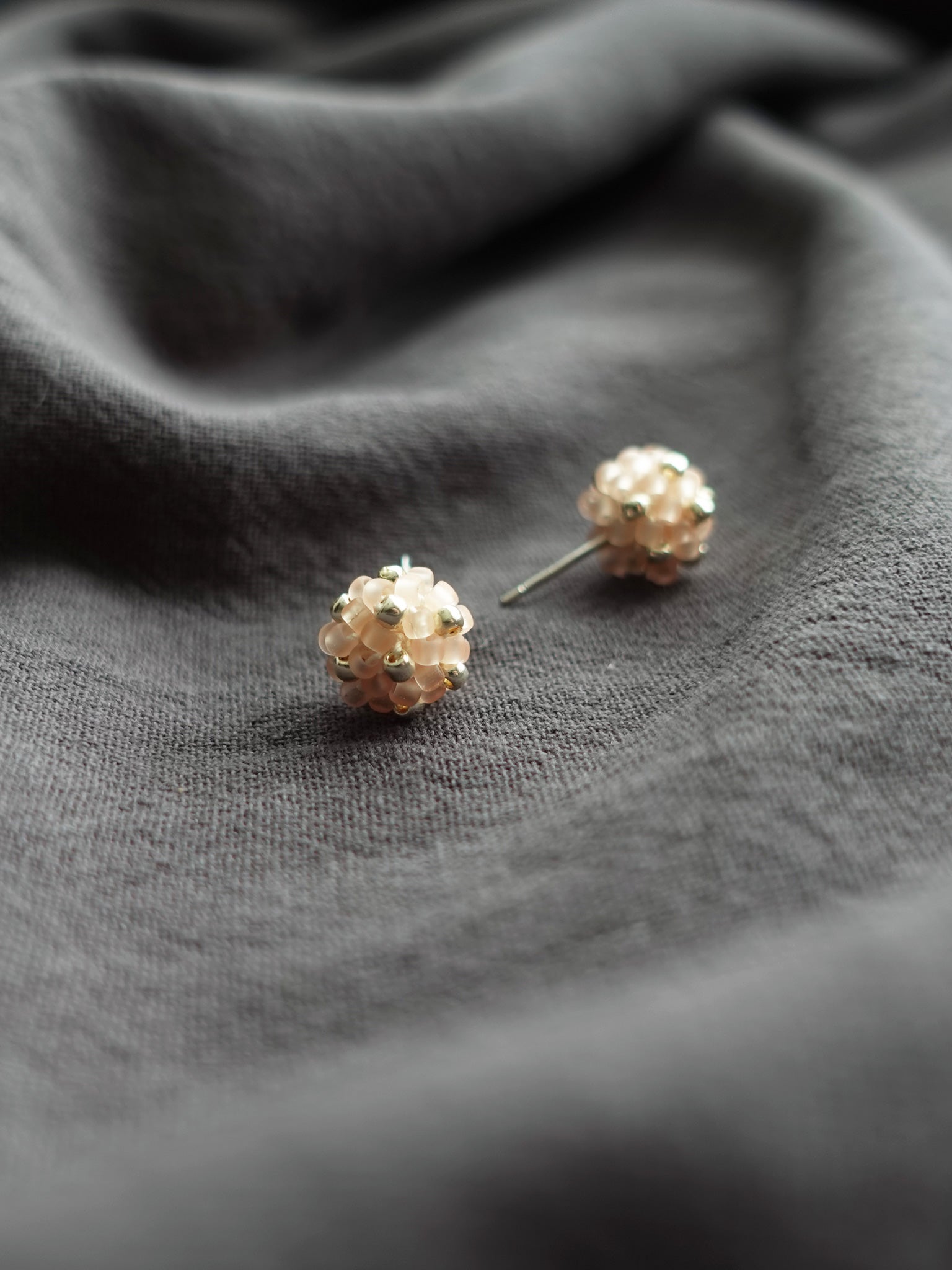 Orb Star Dust Stud Earrings in Blush Pink Front