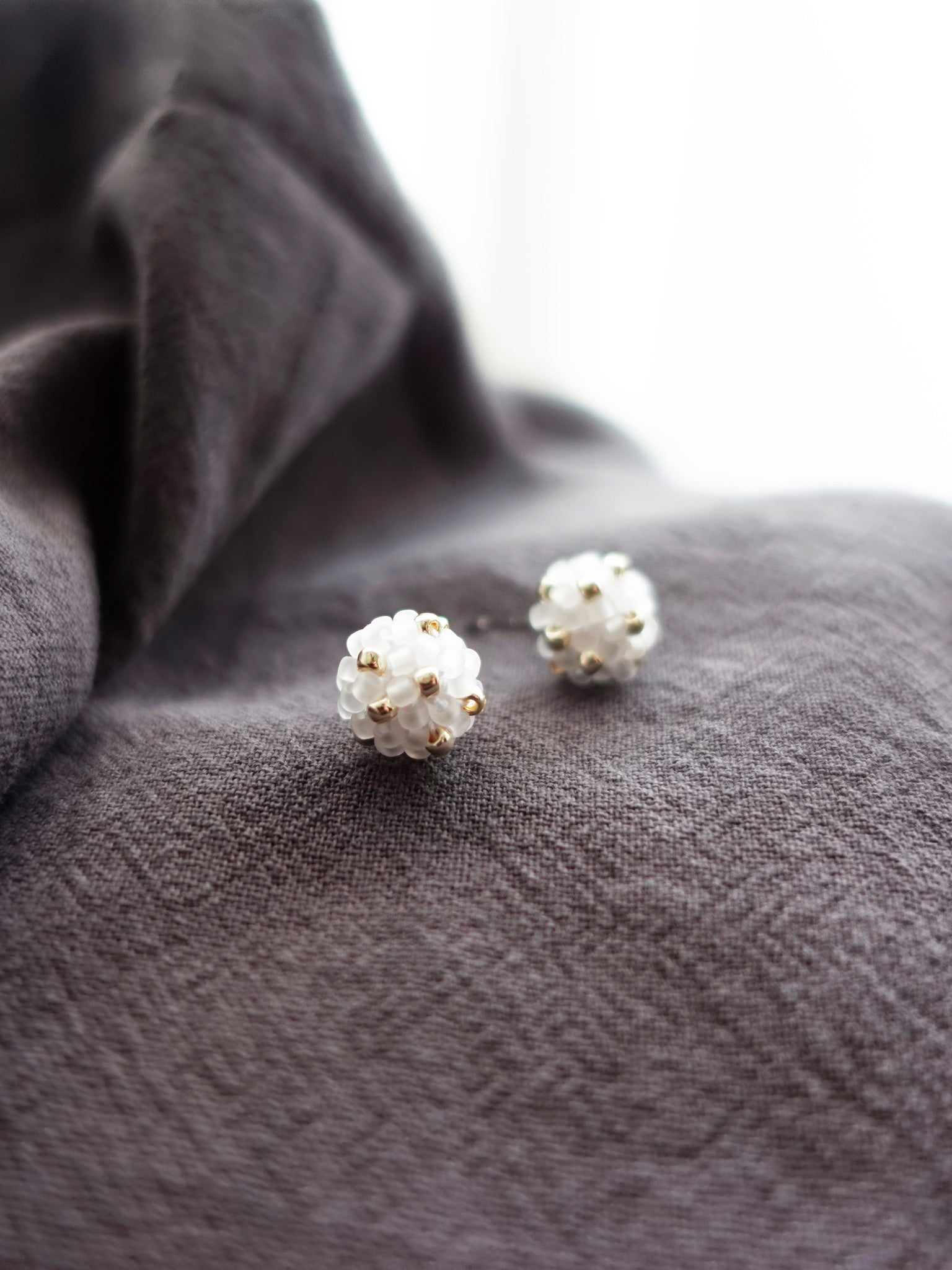 Orb Star Dust Stud Earrings in Cloud White Front