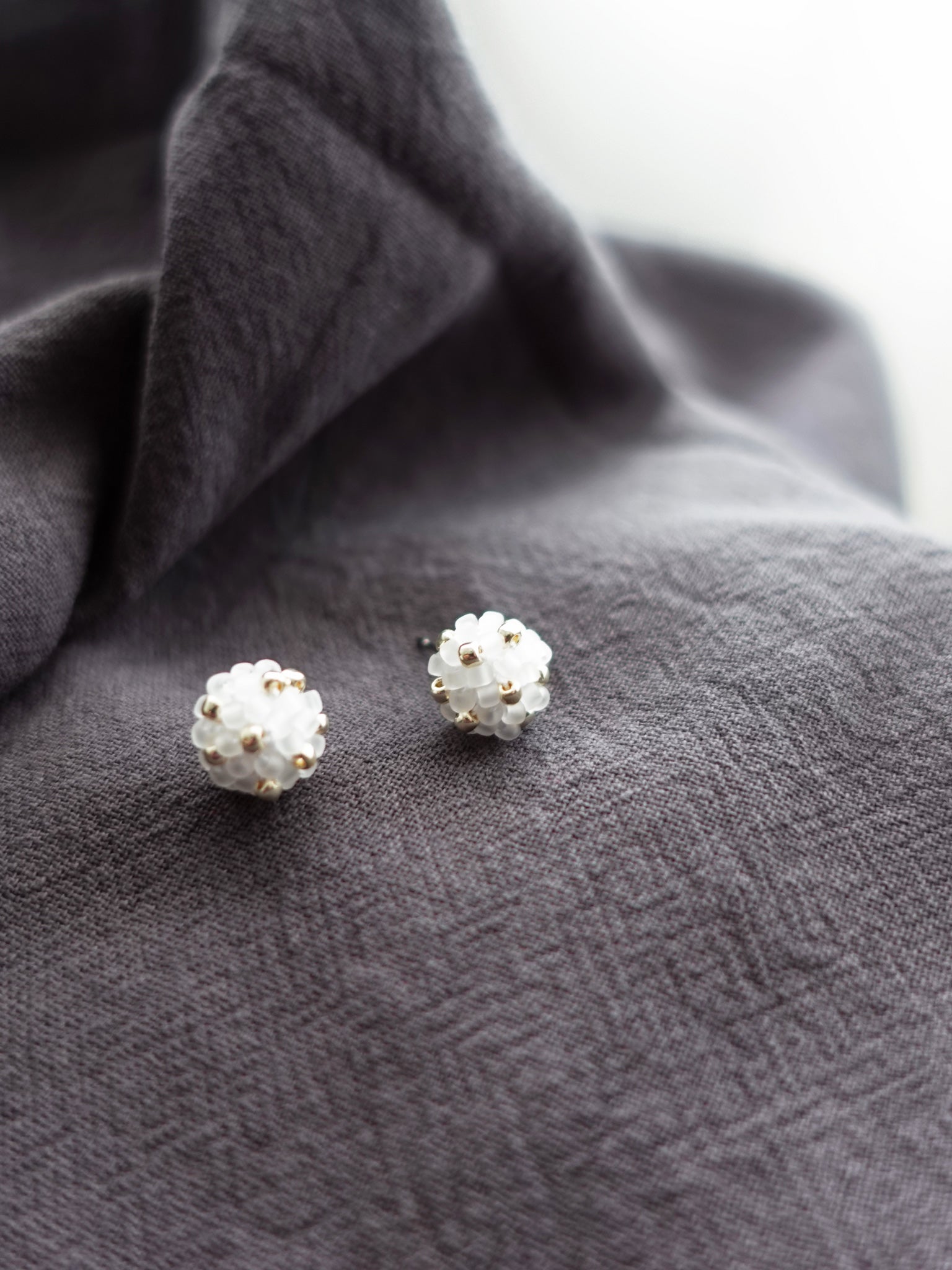 Orb Star Dust Stud Earrings in Cloud White Left