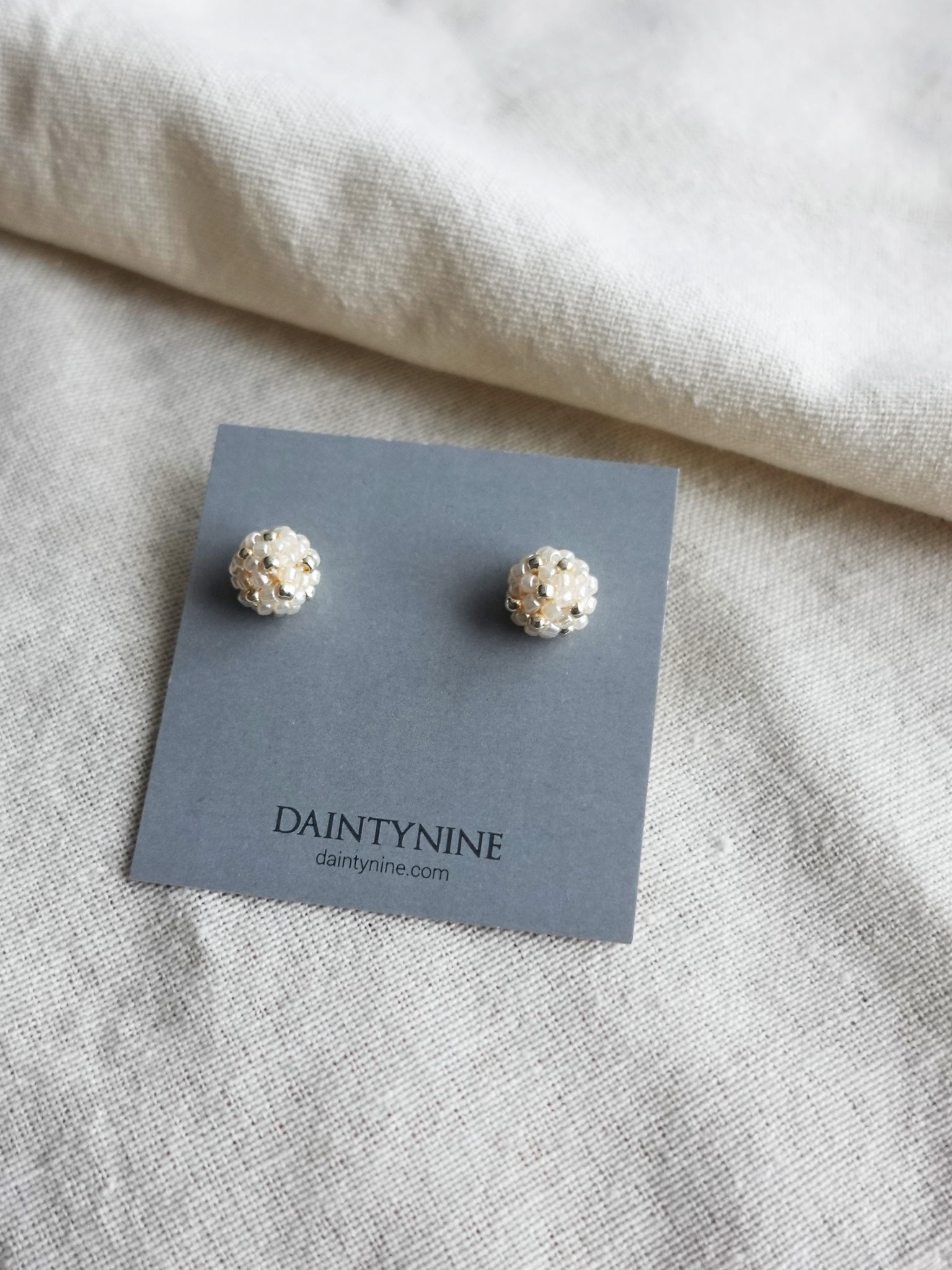 Orb Star Dust Stud Earrings in Ivory Card