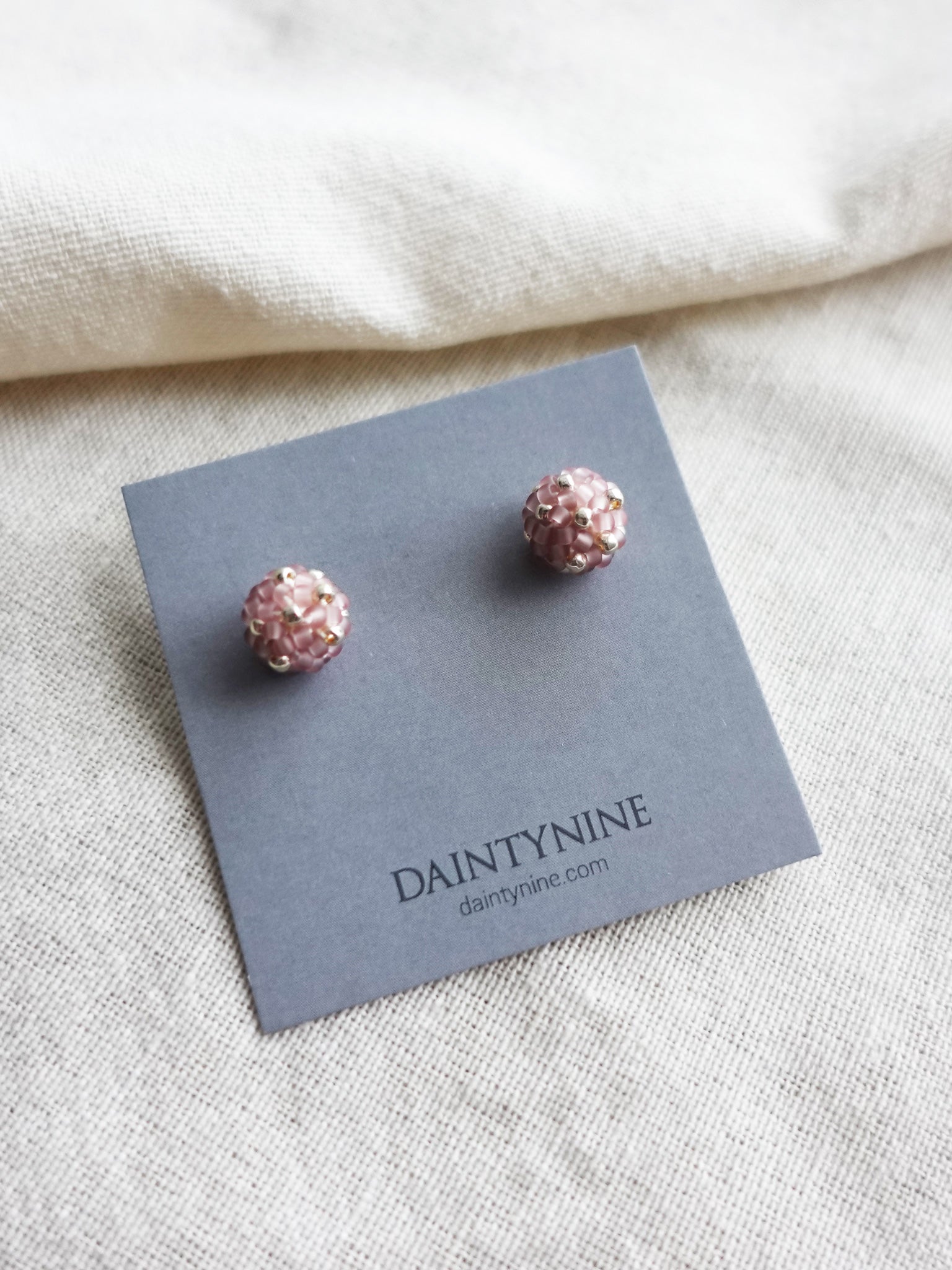 Orb Star Dust Stud Earrings in Mauve Purple Card