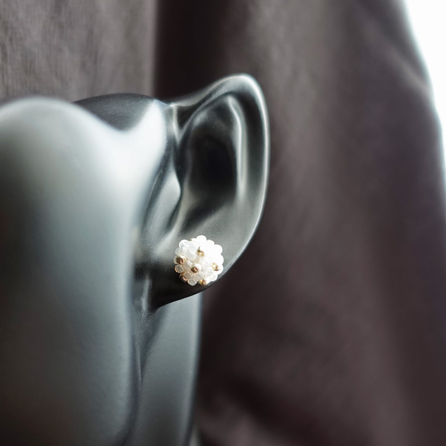 Orb Star Dust Stud Earrings in White Bust