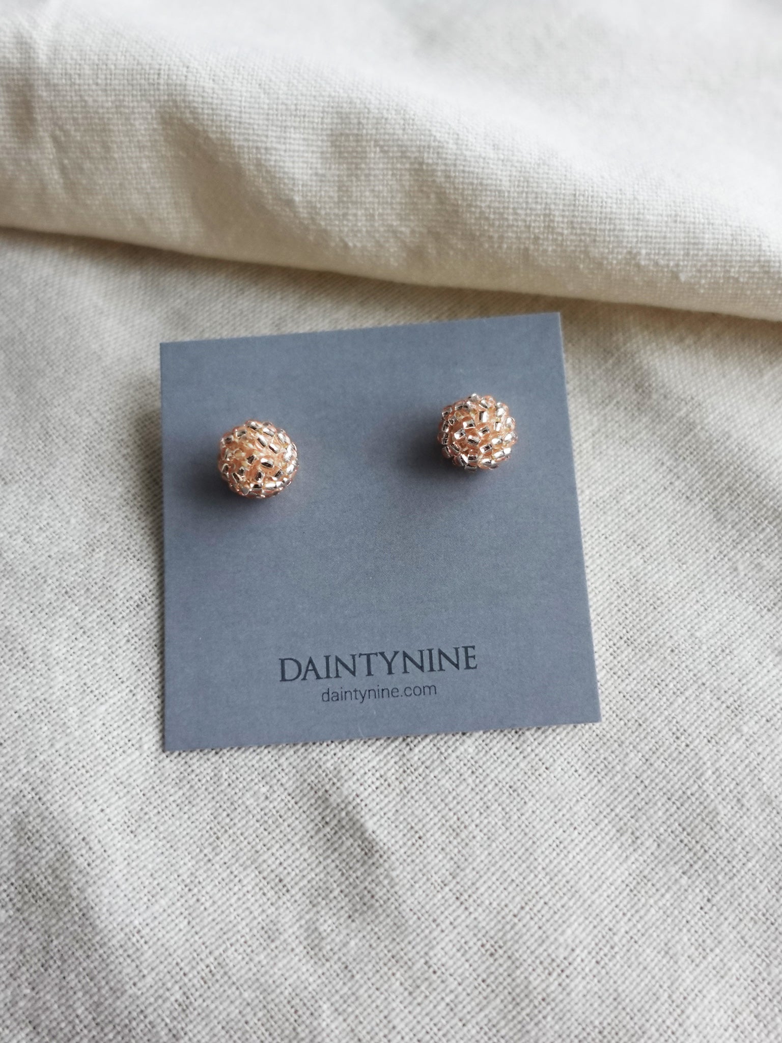 Orb Stud Earrings in Champagne Pink Card