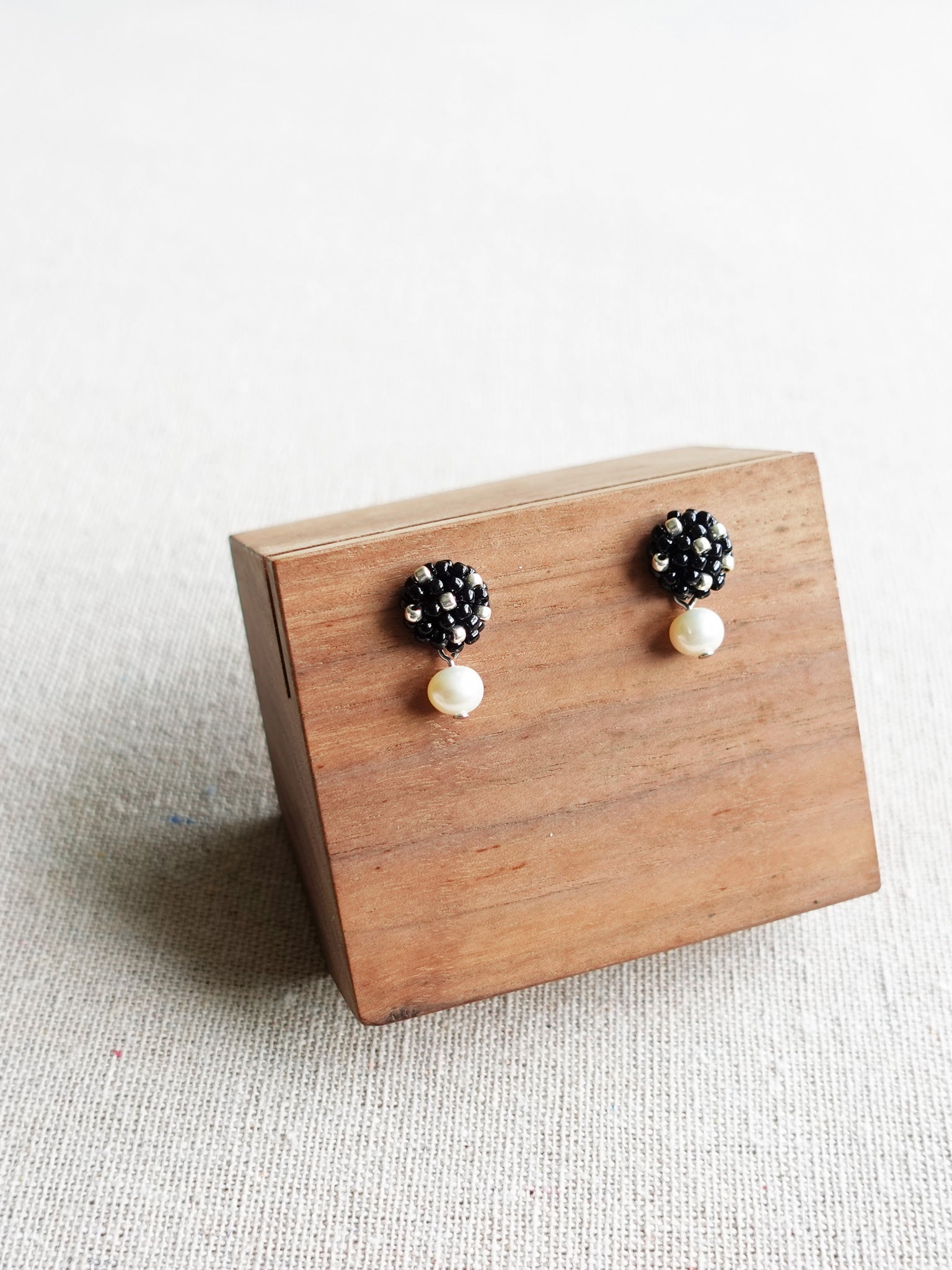 Phoebe Star Dust Earrings in Black Display Left