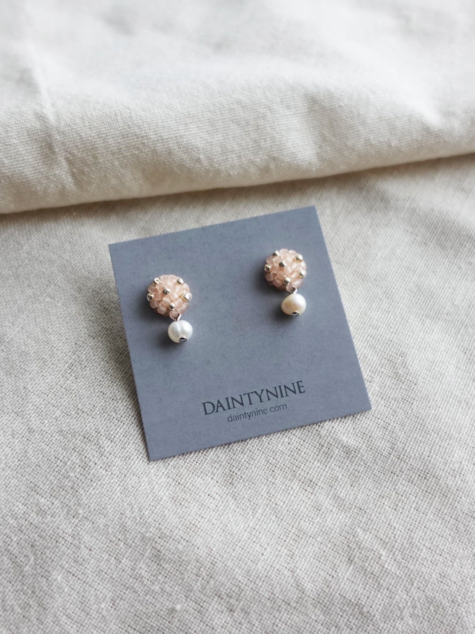 Phoebe Star Dust Earrings in Blush Pink Card