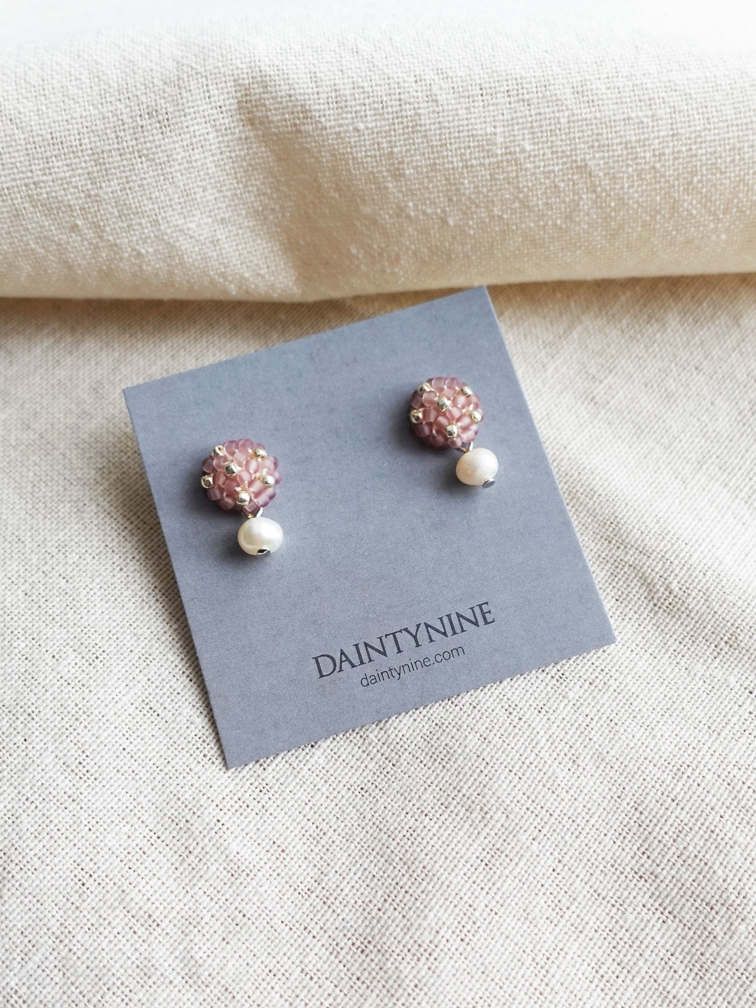 Phoebe Star Dust Earrings in Mauve Purple Card Front