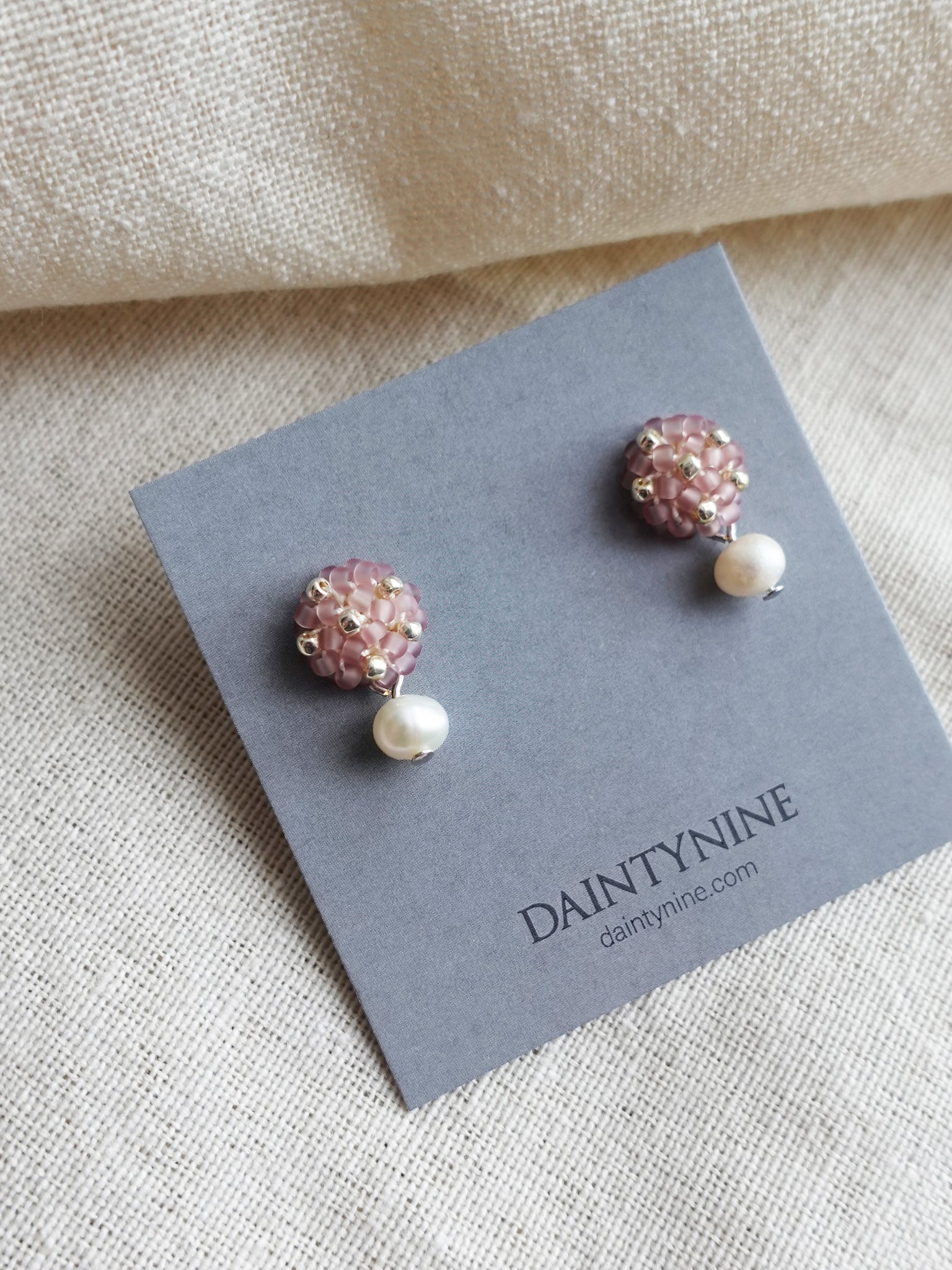 Phoebe Star Dust Earrings in Mauve Purple Card Left