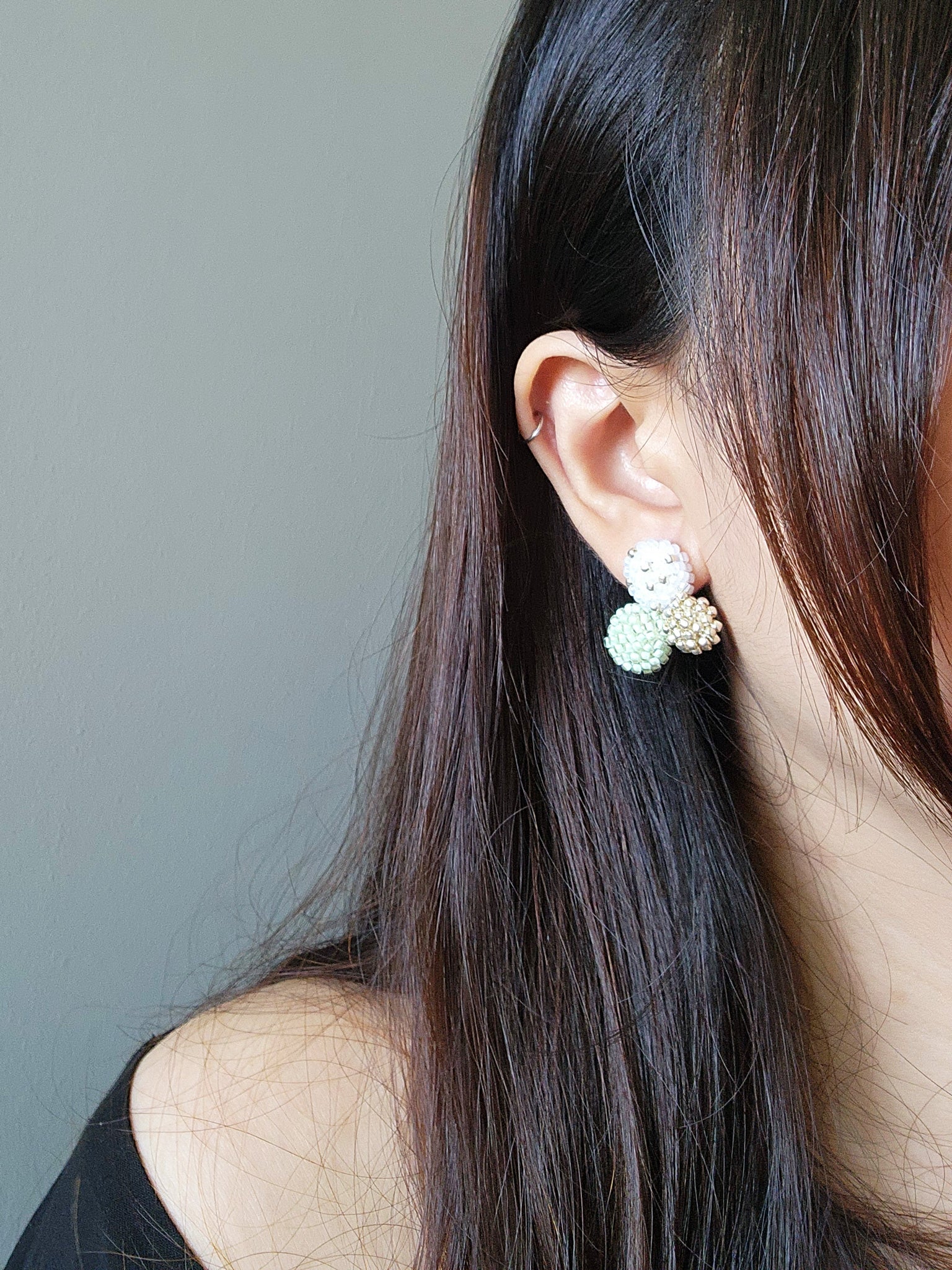 Planetarium Stud Earrings in Mint Green Model