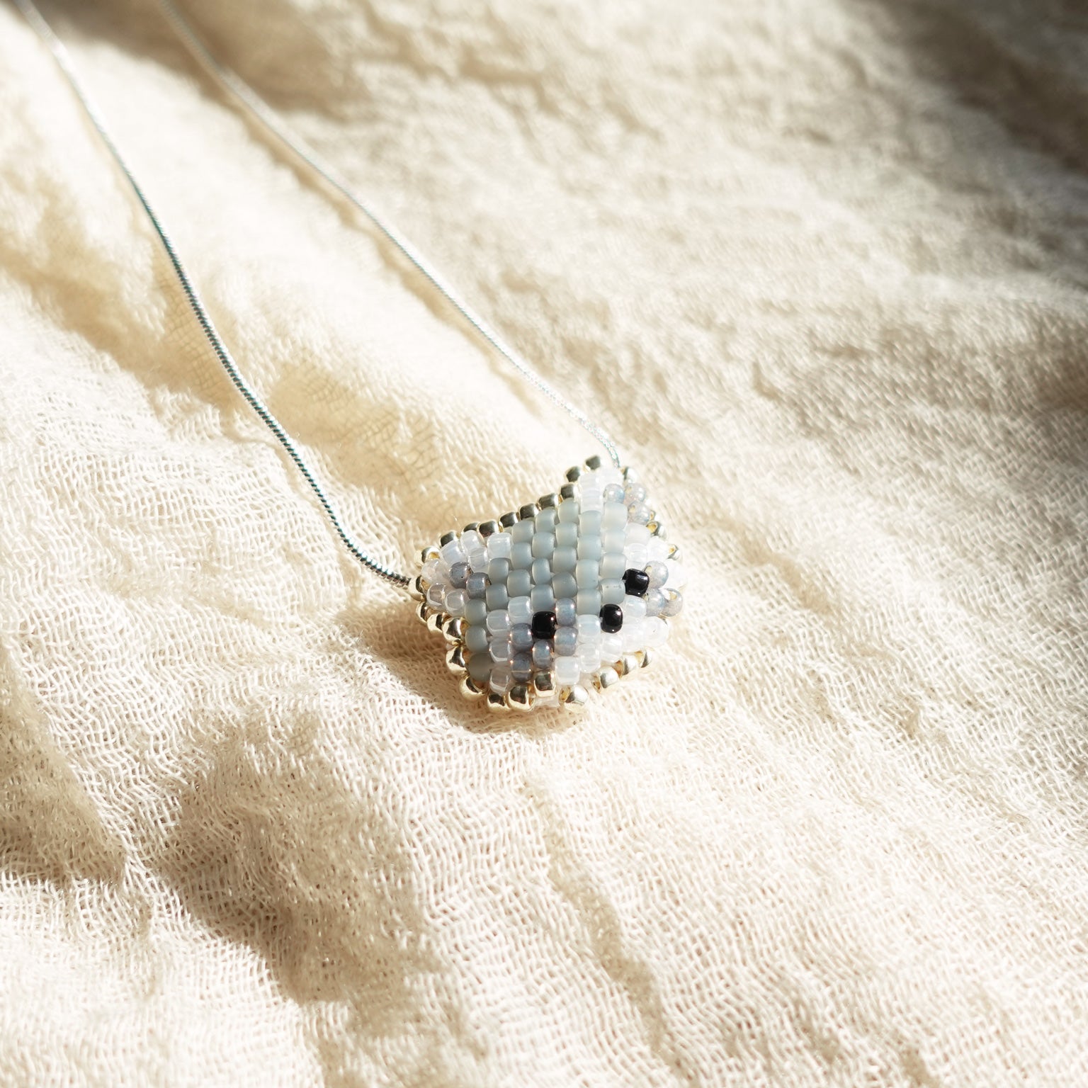 Raccoon Necklace Left