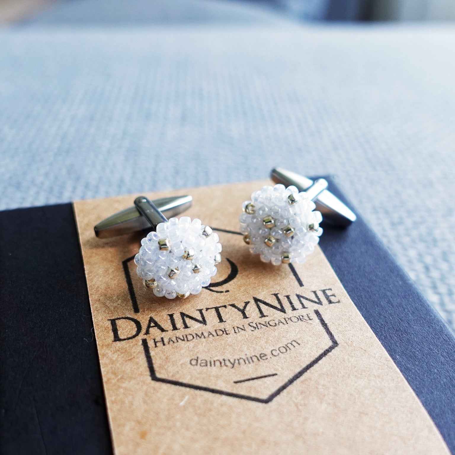 Star Dust Delica Cufflink in White Above Box