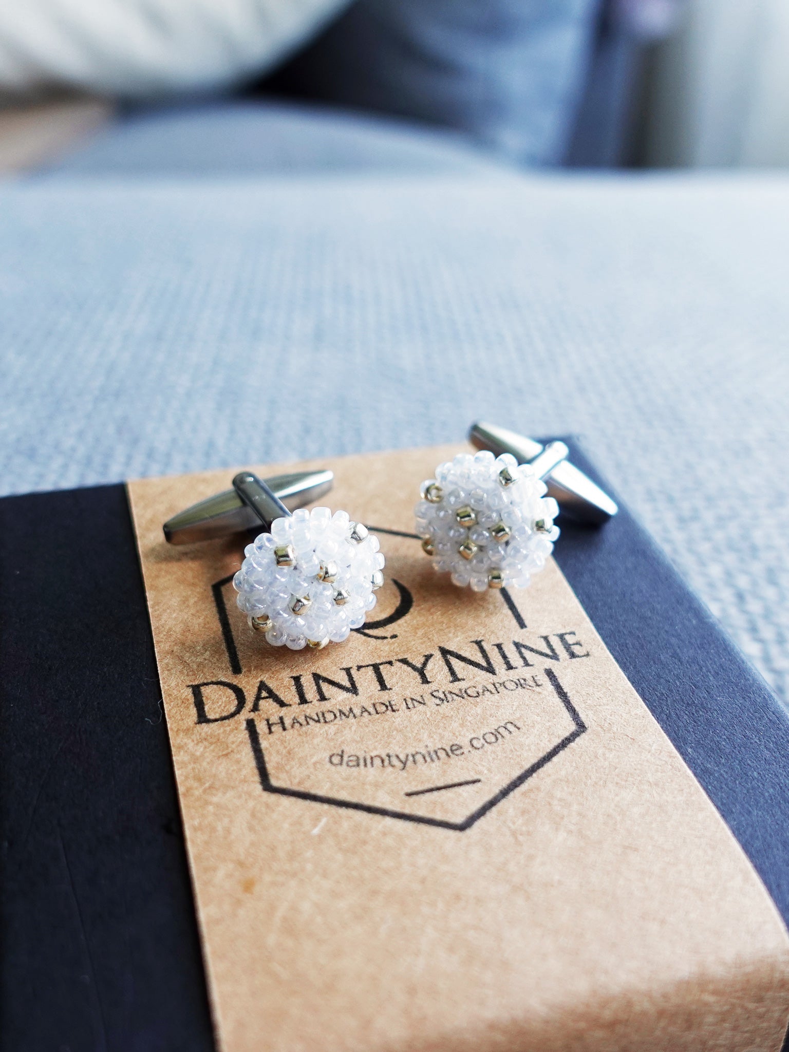 Star Dust Delica Cufflink in White Above Box
