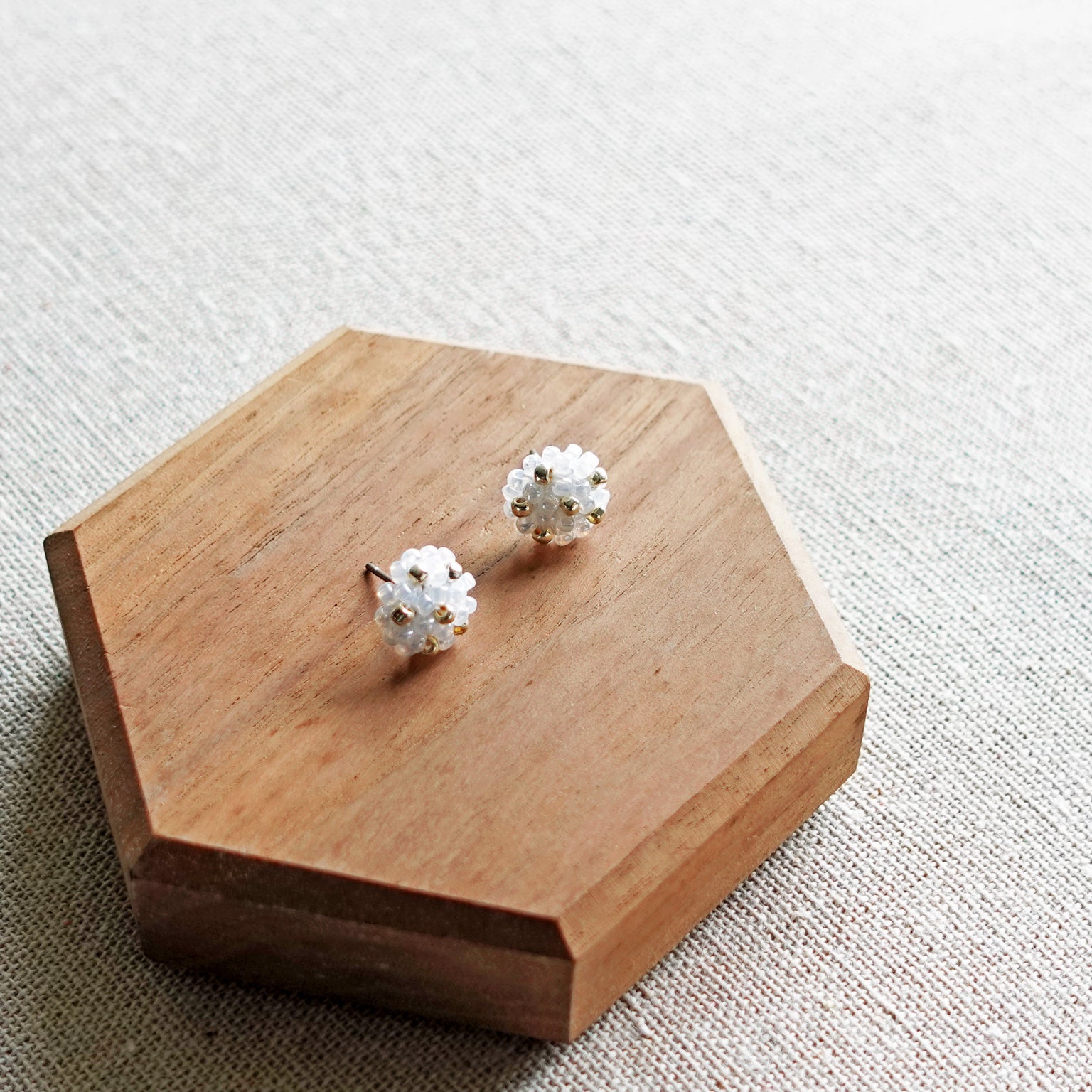 Star Dust Petite Stud Earrings in White Display Top Down