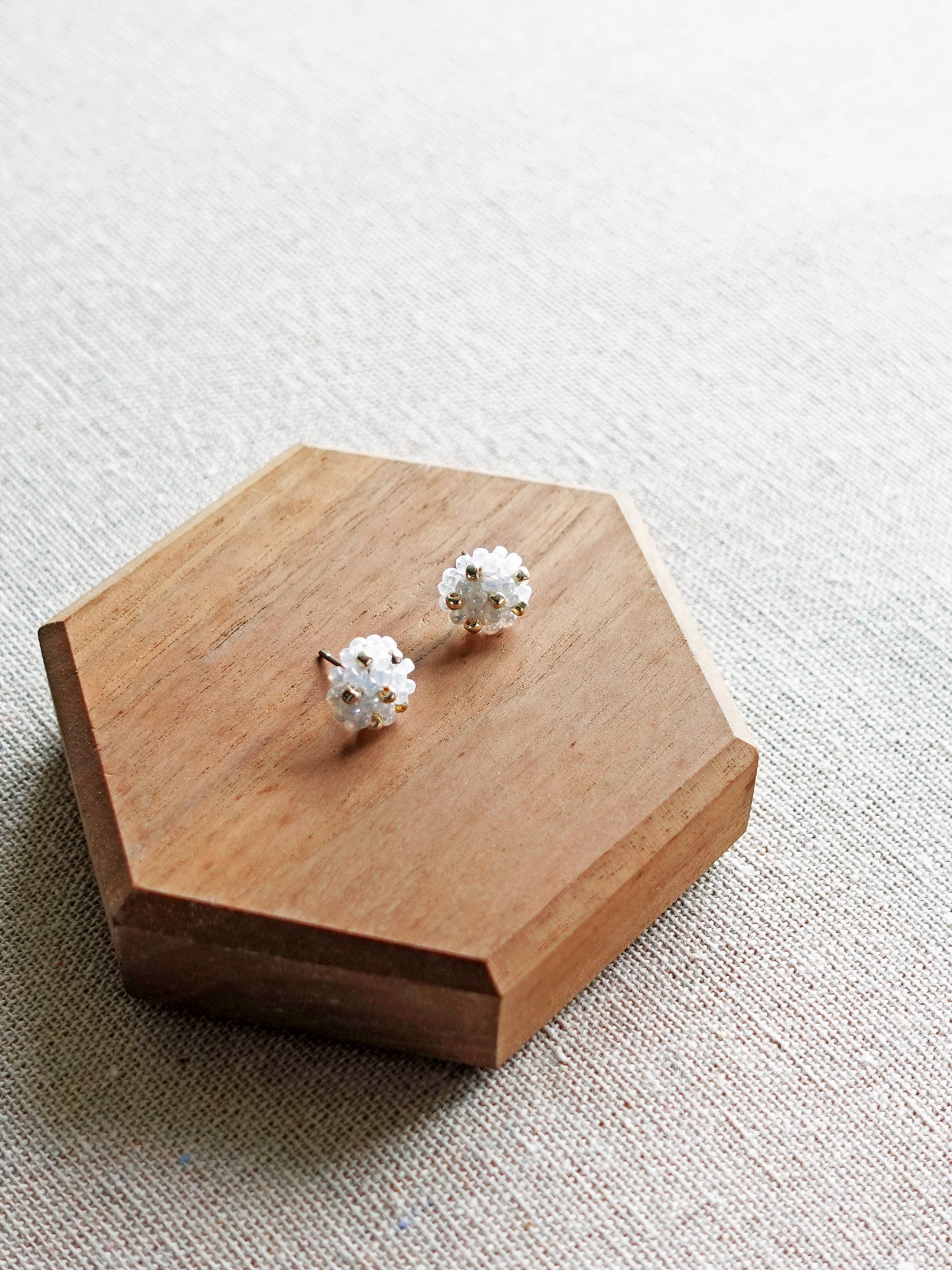 Star Dust Petite Stud Earrings in White Display Top Down