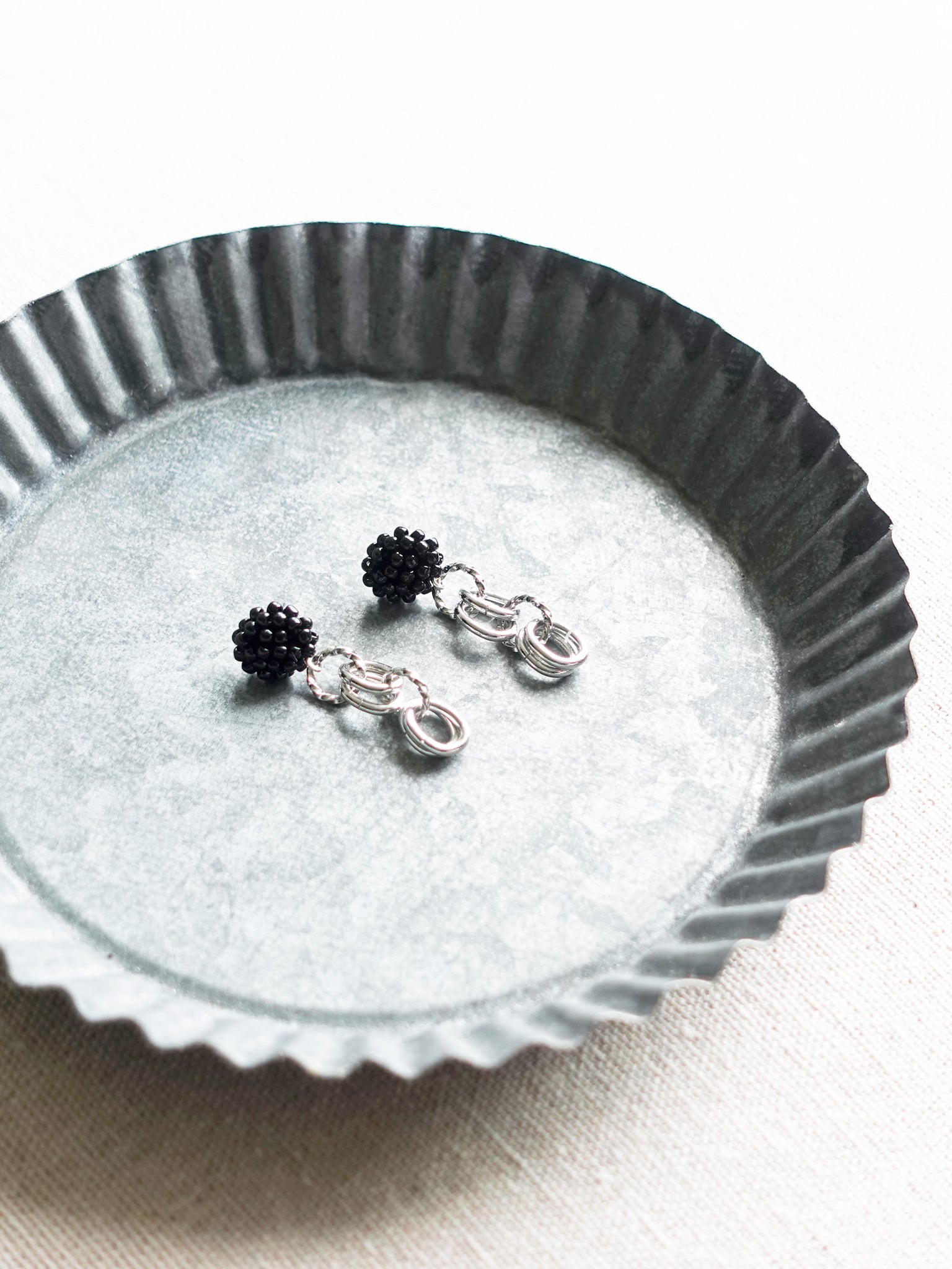 Xanthia Earrings in Black Tray Right