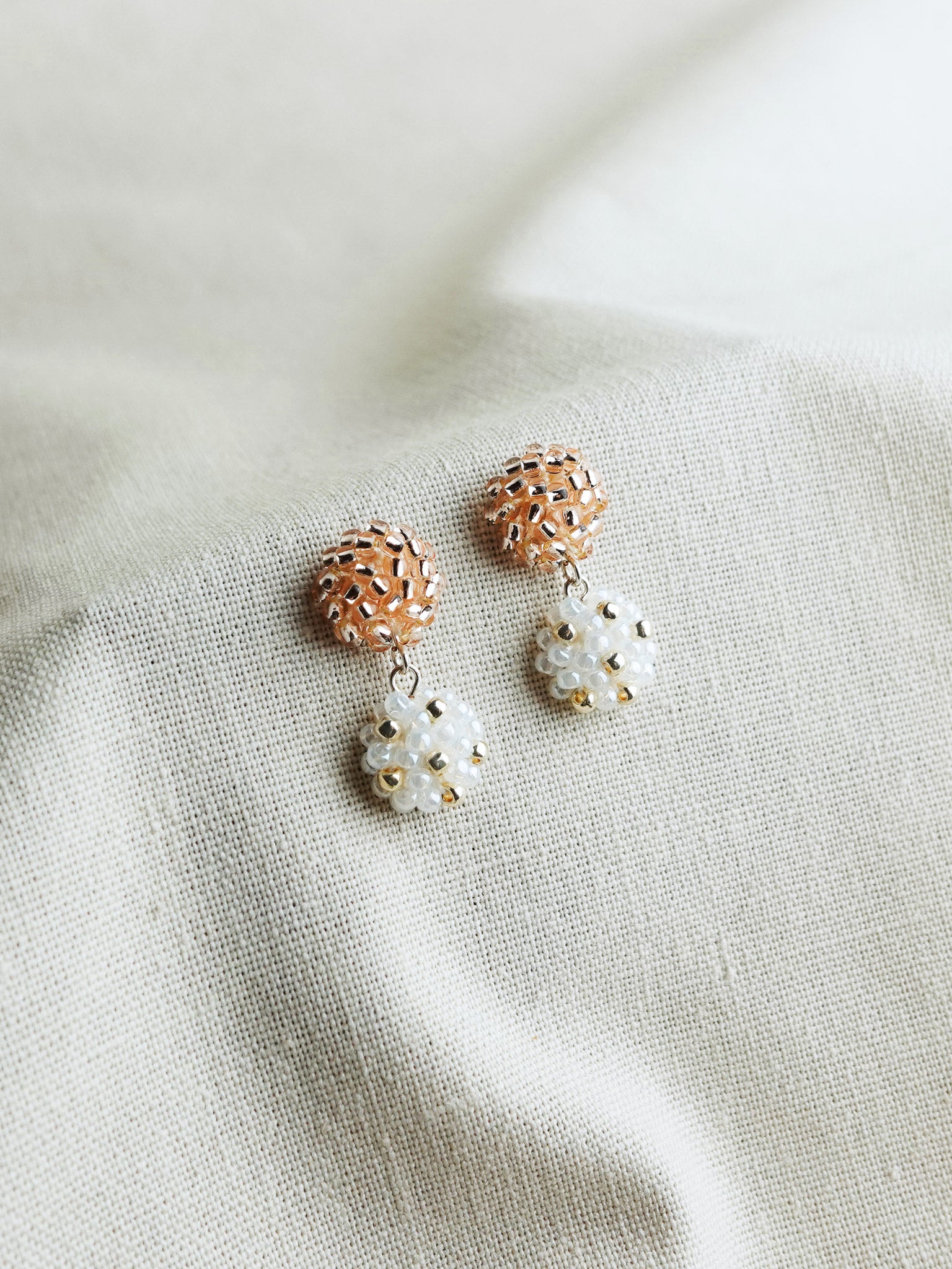 Abigail Earrings in Champagne Pink Left