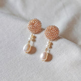 Calypso Dangle Earrings in Champagne Pink Front 1