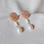 Calypso Dangle Earrings in Champagne Pink Left 1