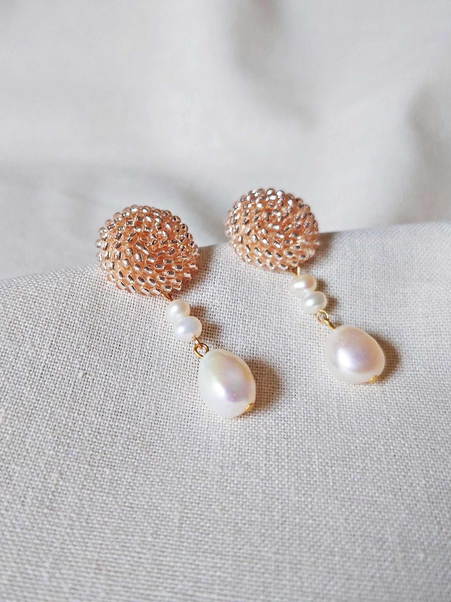 Calypso Dangle Earrings in Champagne Pink Left 2