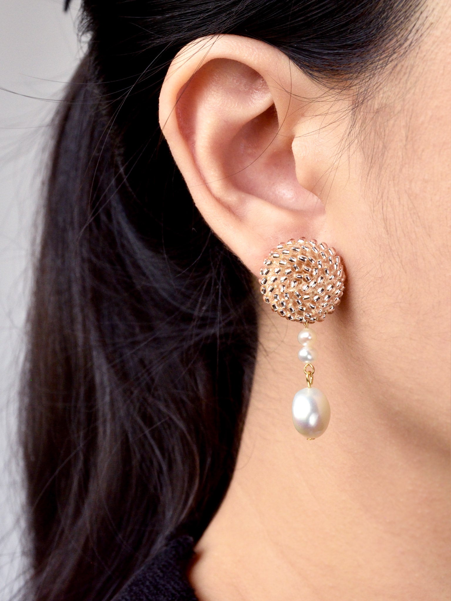 Calypso Dangle Earrings in Champagne Pink Model