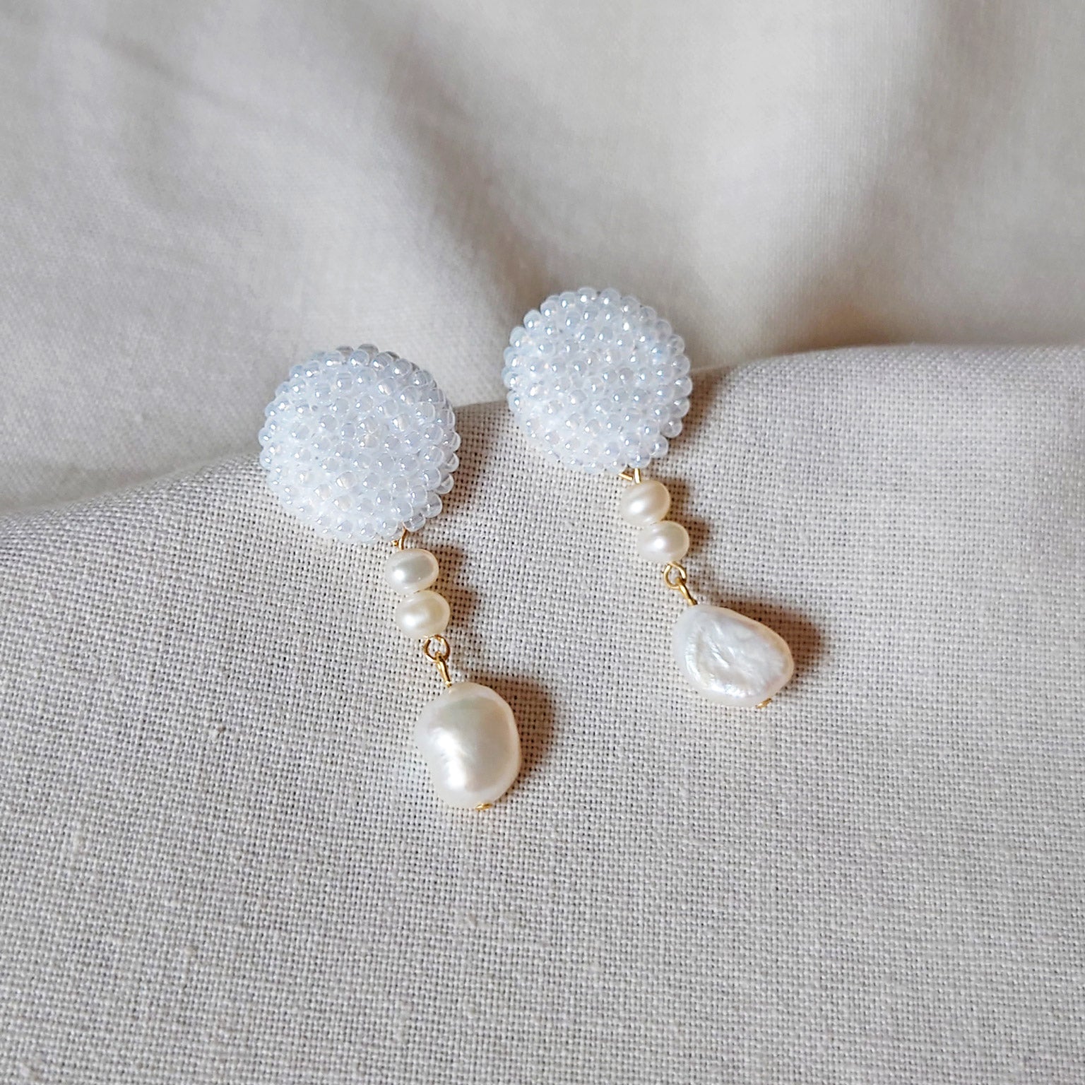 Calypso Dangle Earrings in White Left