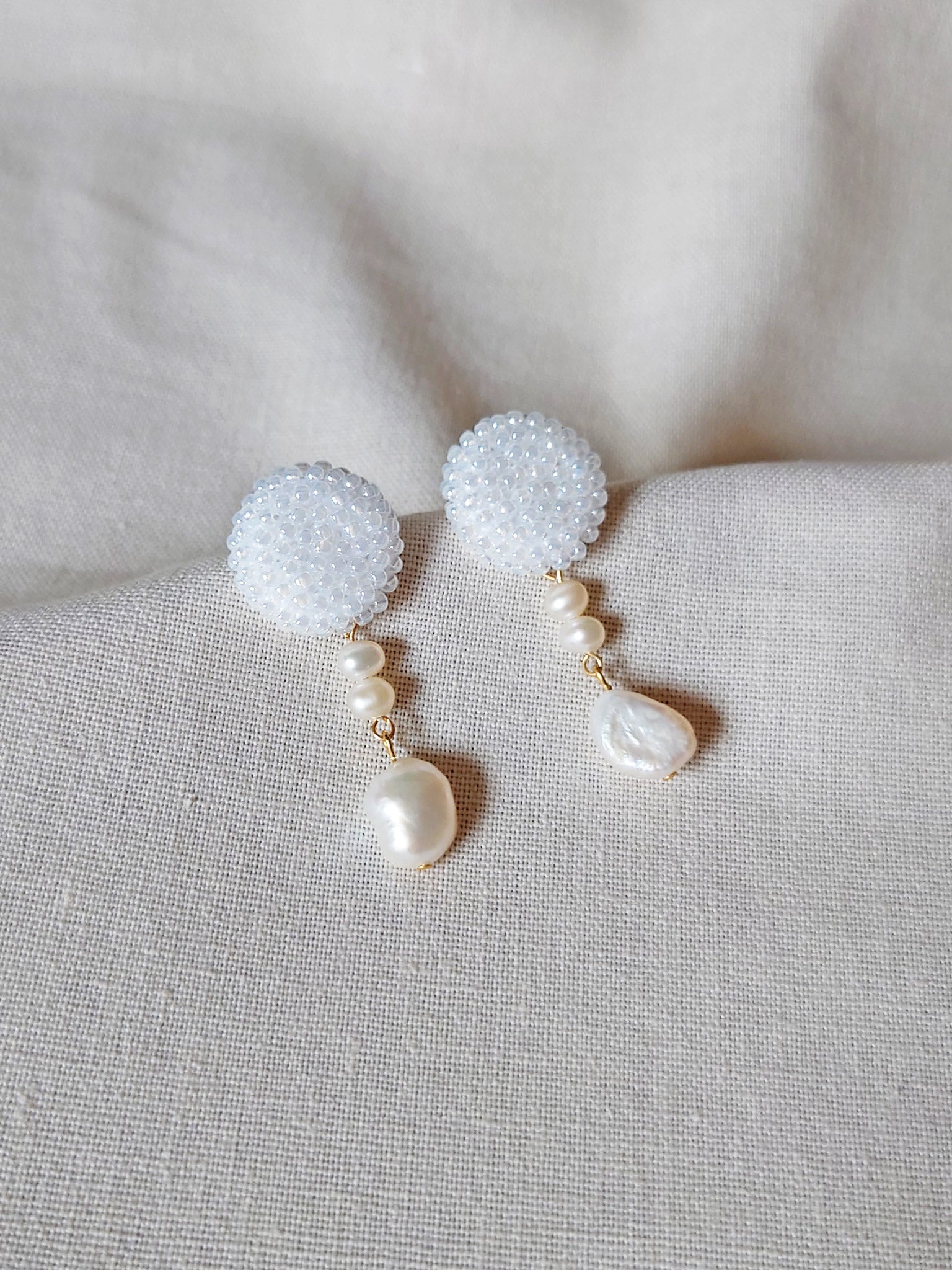 Calypso Dangle Earrings in White Left