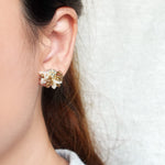 Camellia Bicolor Stud Earrings in Caramel Brown Model