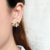Camellia Bicolor Stud Earrings in Caramel Brown Model