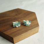 Camellia Bicolor Stud Earrings in Ocean Green Display Front