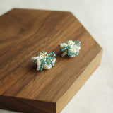 Camellia Bicolor Stud Earrings in Ocean Green Display Left