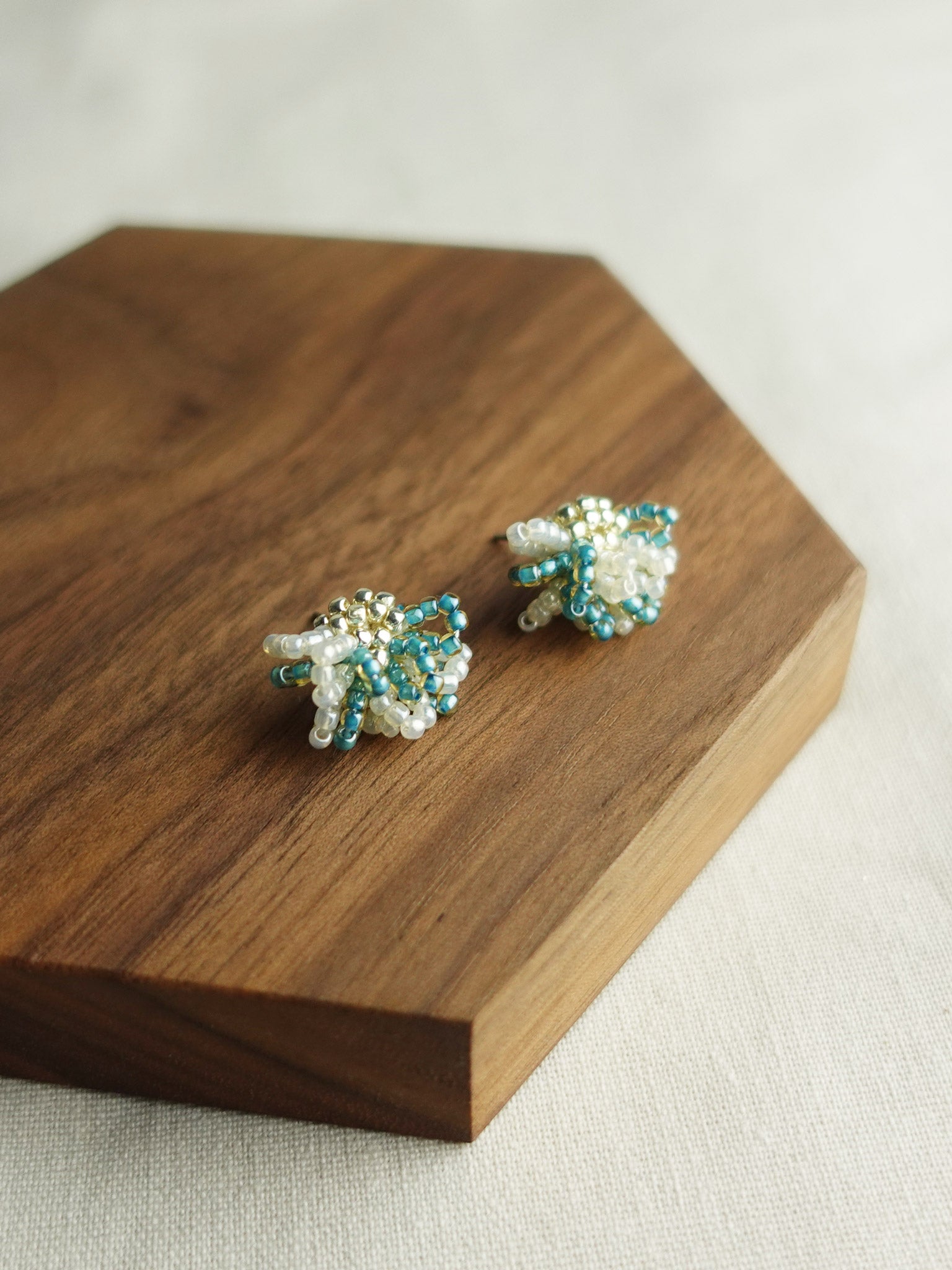 Camellia Bicolor Stud Earrings in Ocean Green Display Left