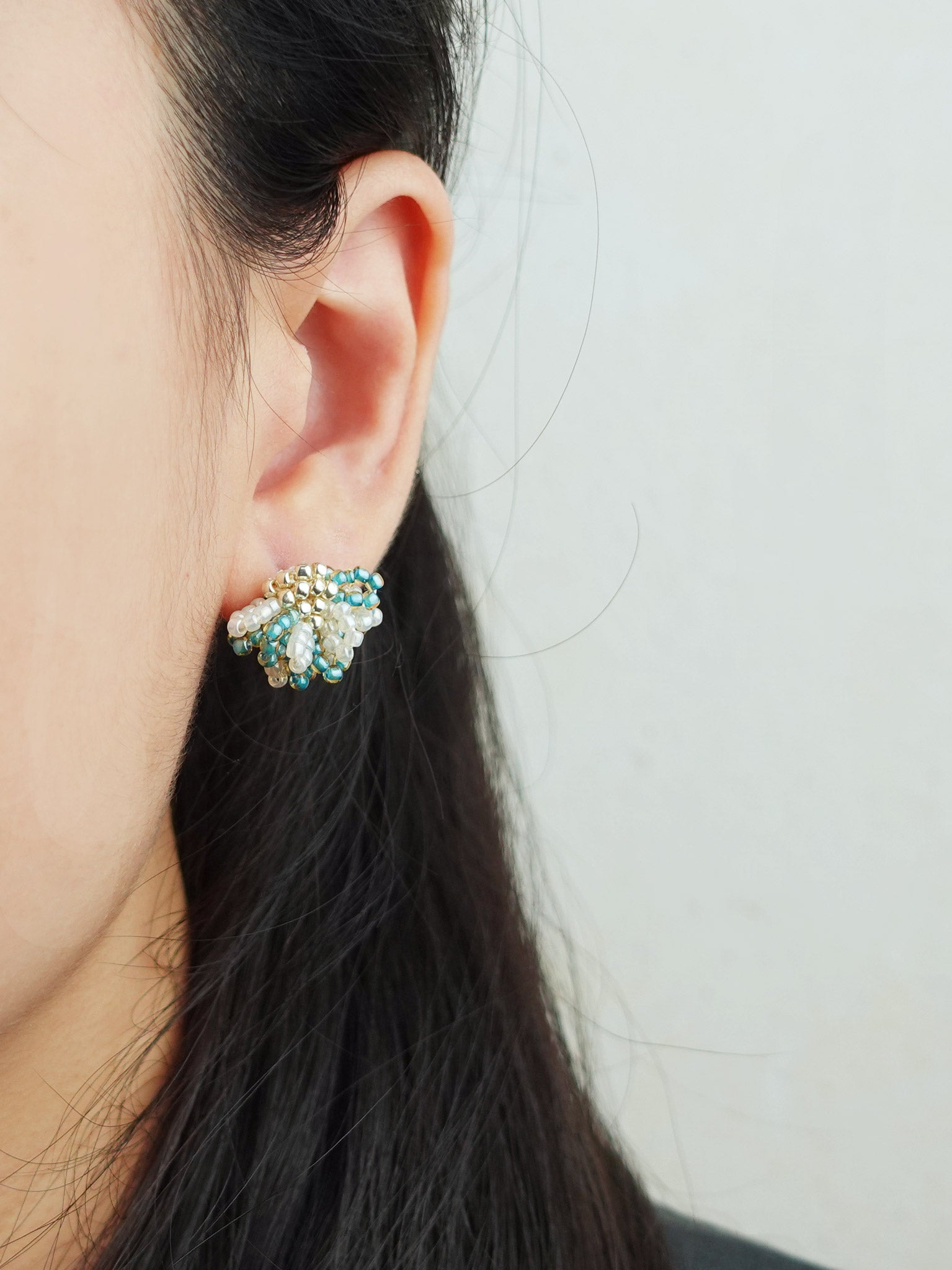 Camellia Bicolor Stud Earrings in Ocean Green Model