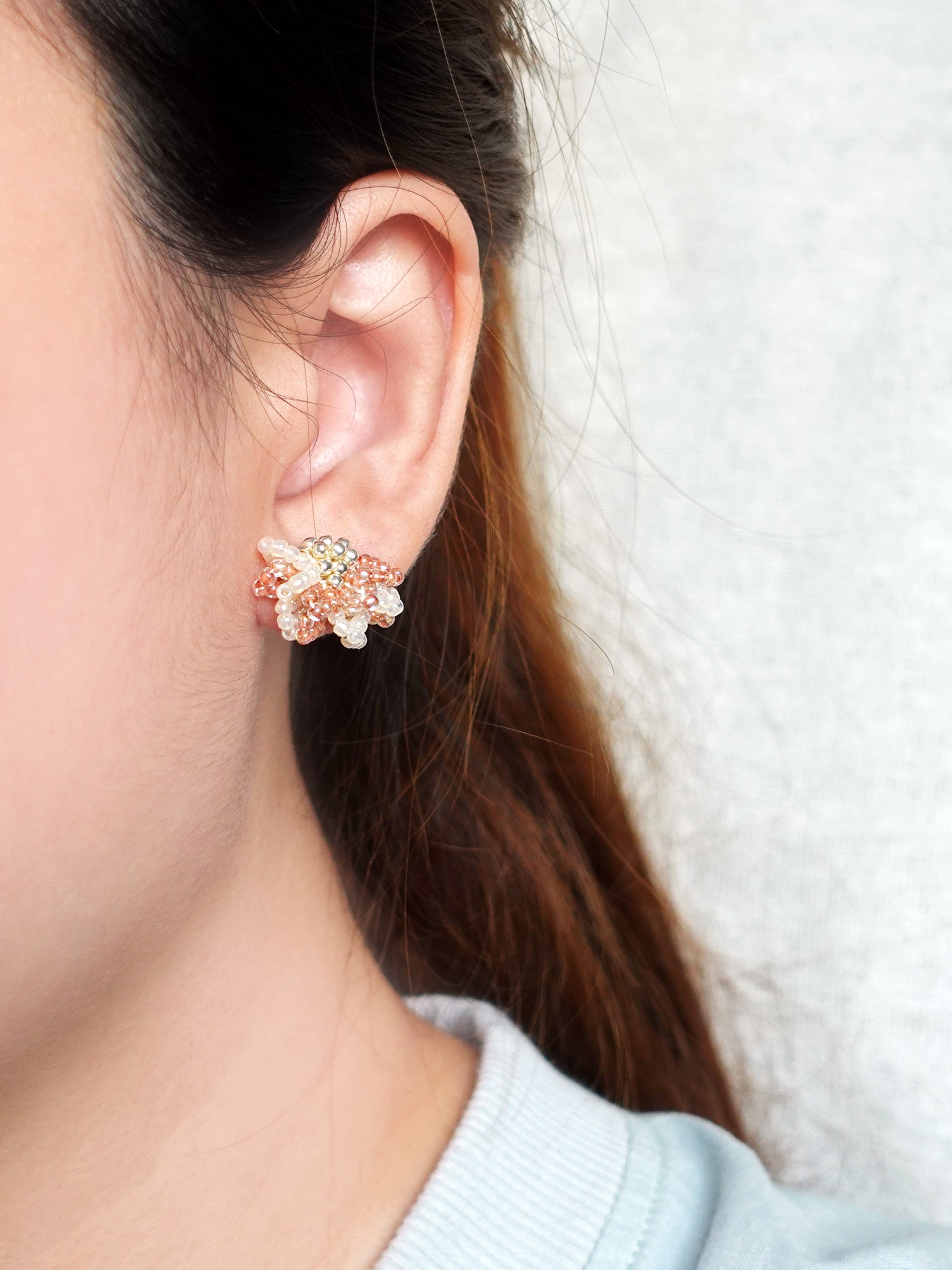 Camellia Bicolor Stud Earrings in Strawberry Red Model