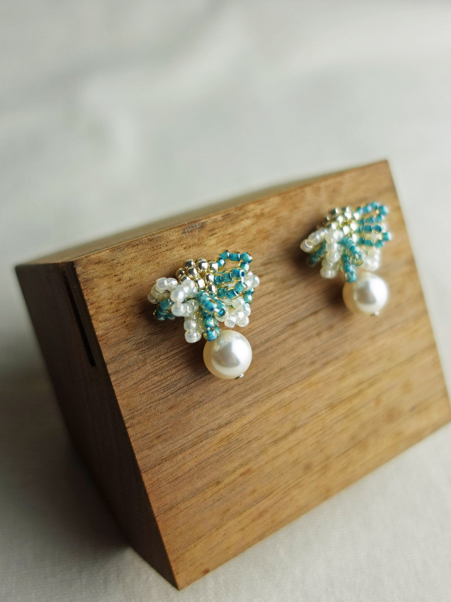 Camellia Mariota Bicolor Earrings in Ocean Green Display