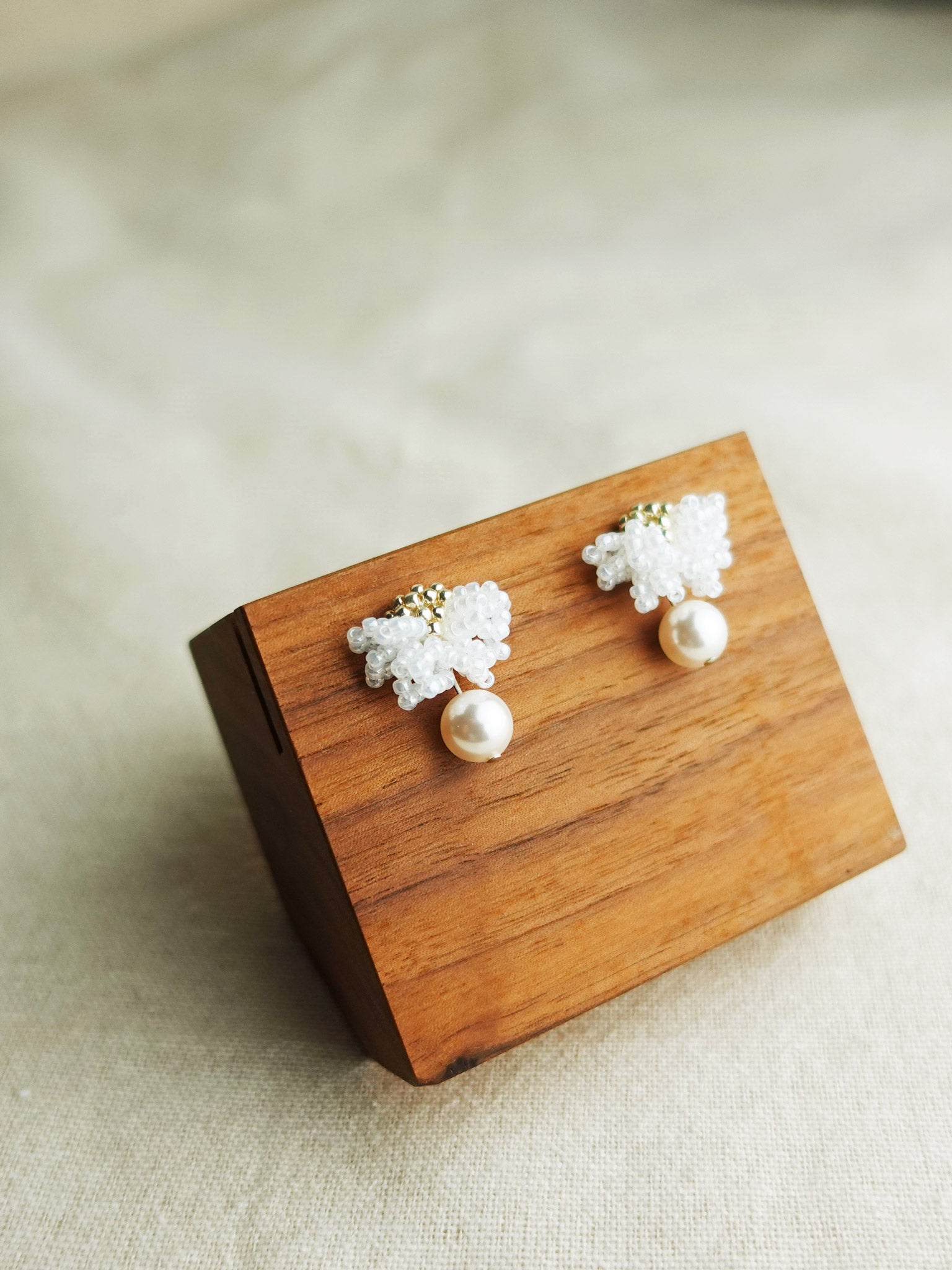 Camellia Mariota Earrings in White Display Left