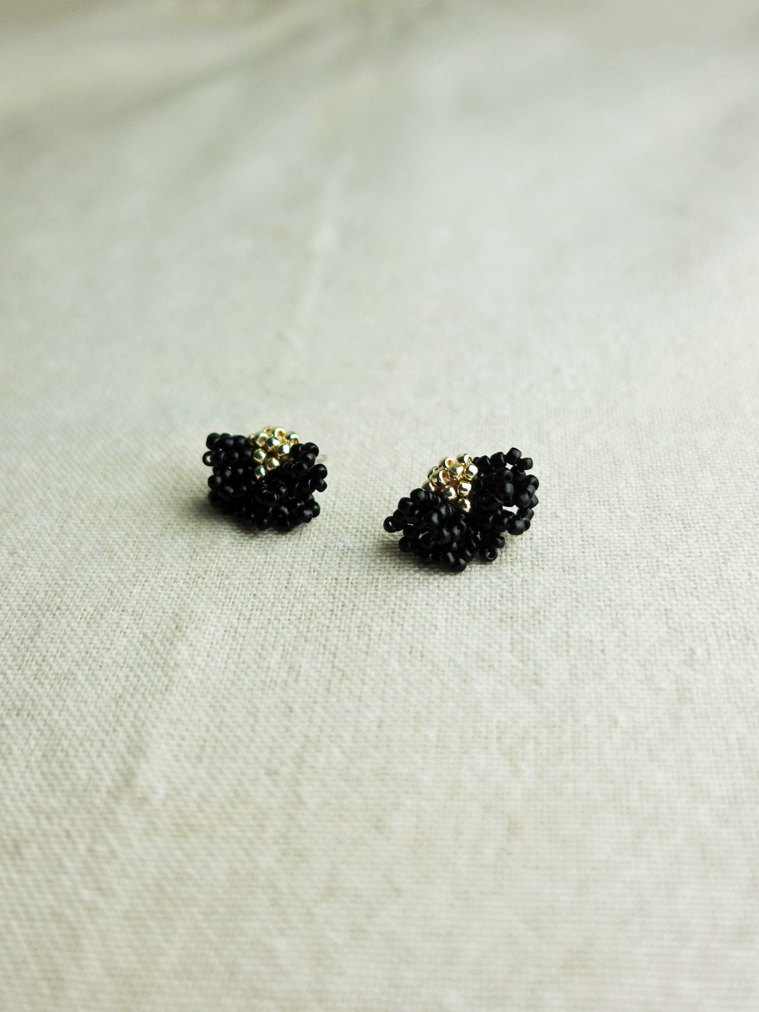 Camellia Stud Earrings in Black Front