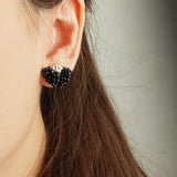 Camellia Stud Earrings in Black Model